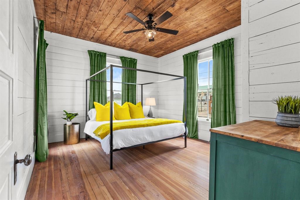 Bedroom two on the second floor. Hardwood floors, stained ceiling and updated ceiling fan. Large windows letting in natural light.