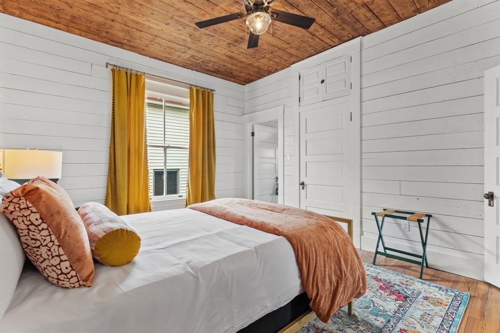 Bedroom three on the second floor. Hardwood floors, stained ceiling and updated ceiling fan. Large window letting in natural light.