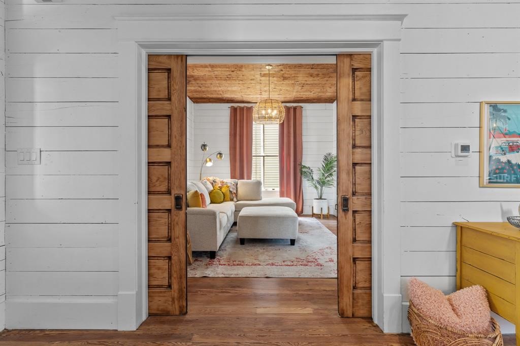 Double pocket doors offering privacy in the living room space Double pocket doors offering privacy in the living room space