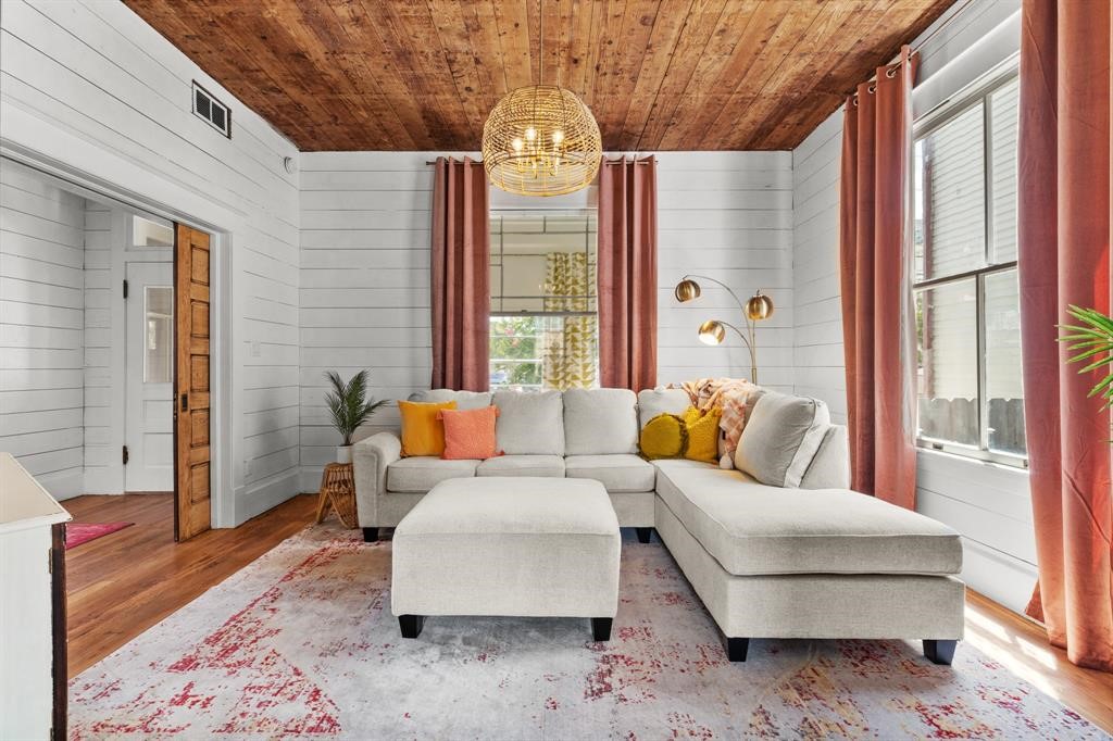Living room right off the entry surrounded by windows letting in natural light Living room right off the entry surrounded by windows letting in natural light