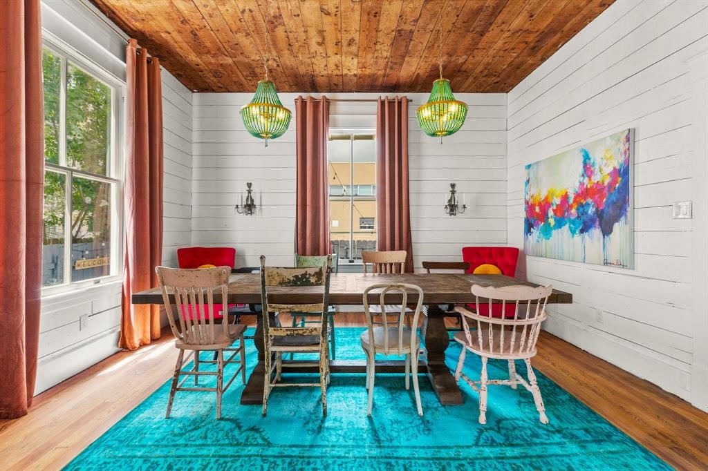 Dining room surrounded by windows letting in natural light