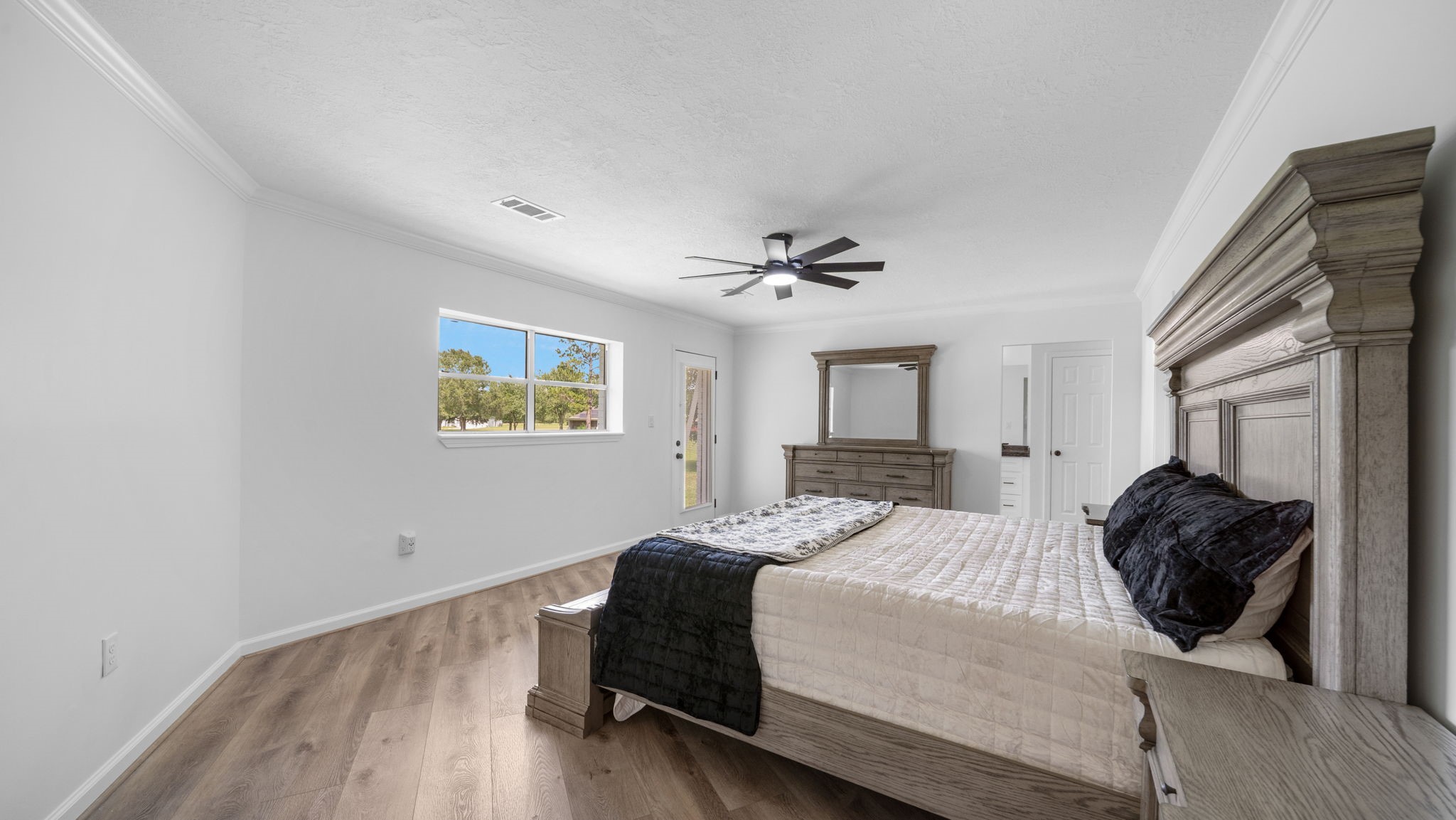 Primary bedroom is large with plenty of room for large furniture exterior door leads to a nice size deck