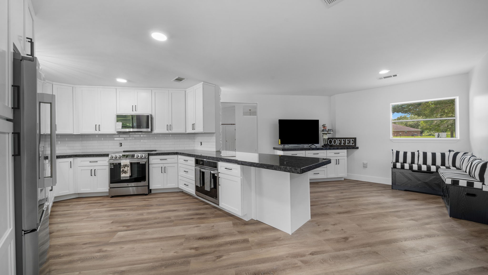 The Kitchen so many cabinets, granite counter top space. Eat in area and bar seating, 2 convection ovens, all new appliances,