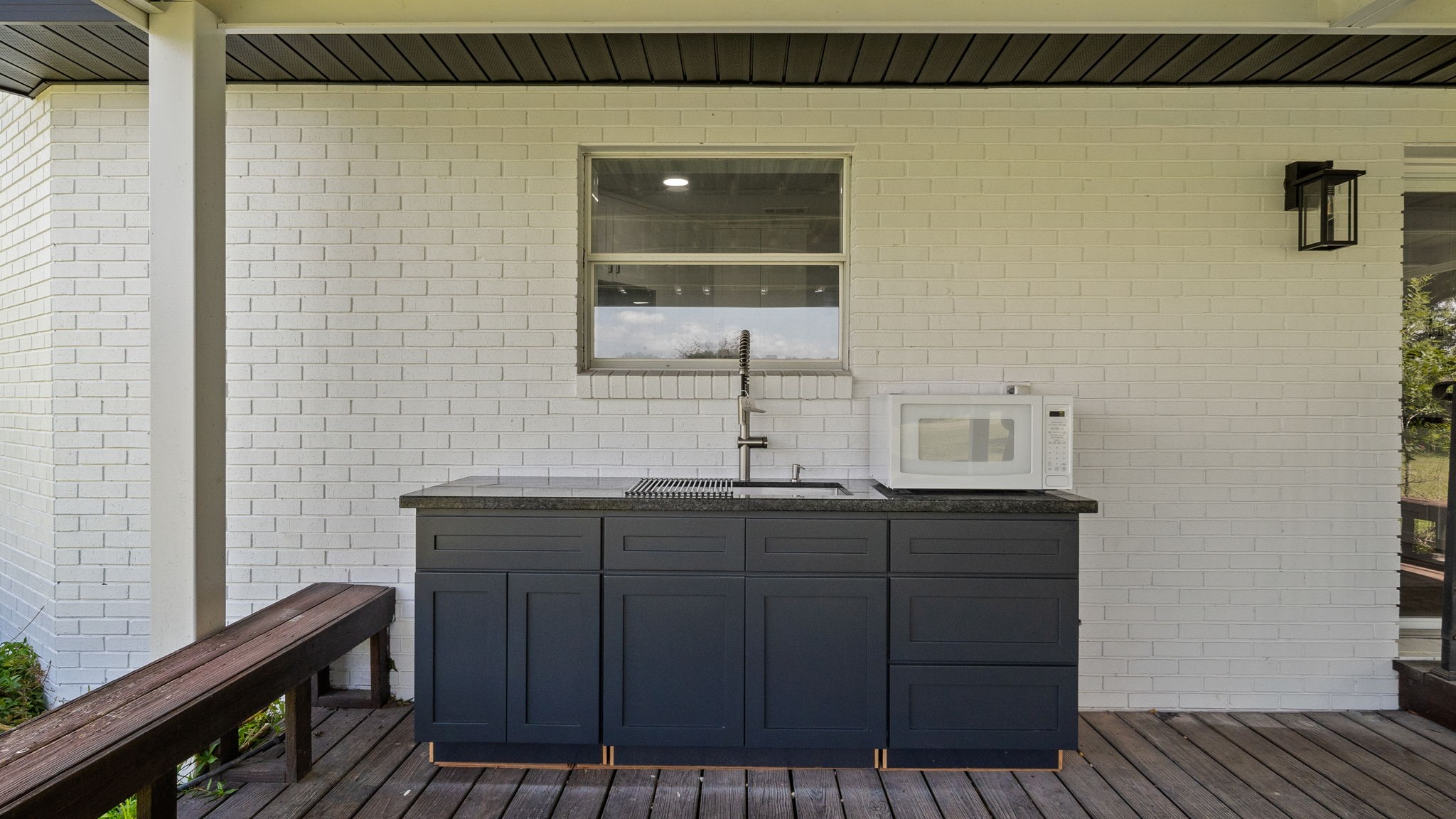 Large prep sink,cabinets and microwave, for out side entertaining. Huge covered porch