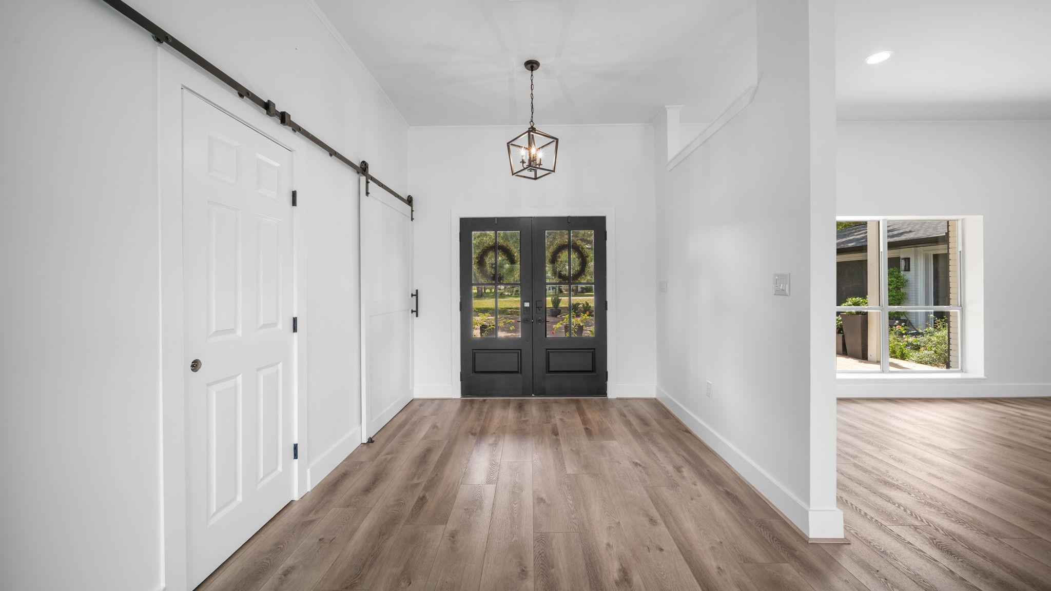 Large entry, Barn doors closing off the bedroom hall ways for more privacy allowing more quiet time in bedrooms