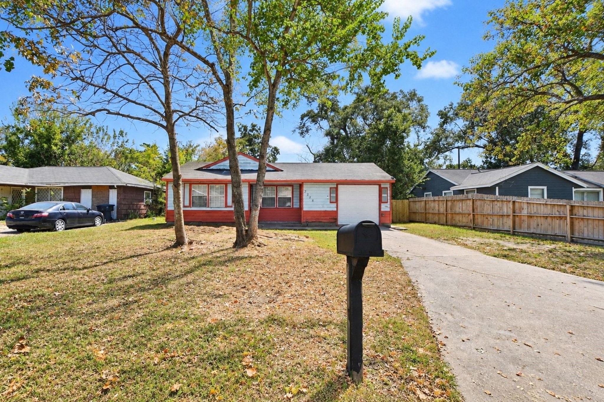 Spacious front yard, a private driveway, an attached garage, and mature trees that add charm and shade to the property. Spacious front yard, a private driveway, an attached garage, and mature trees that add charm and shade to the property.