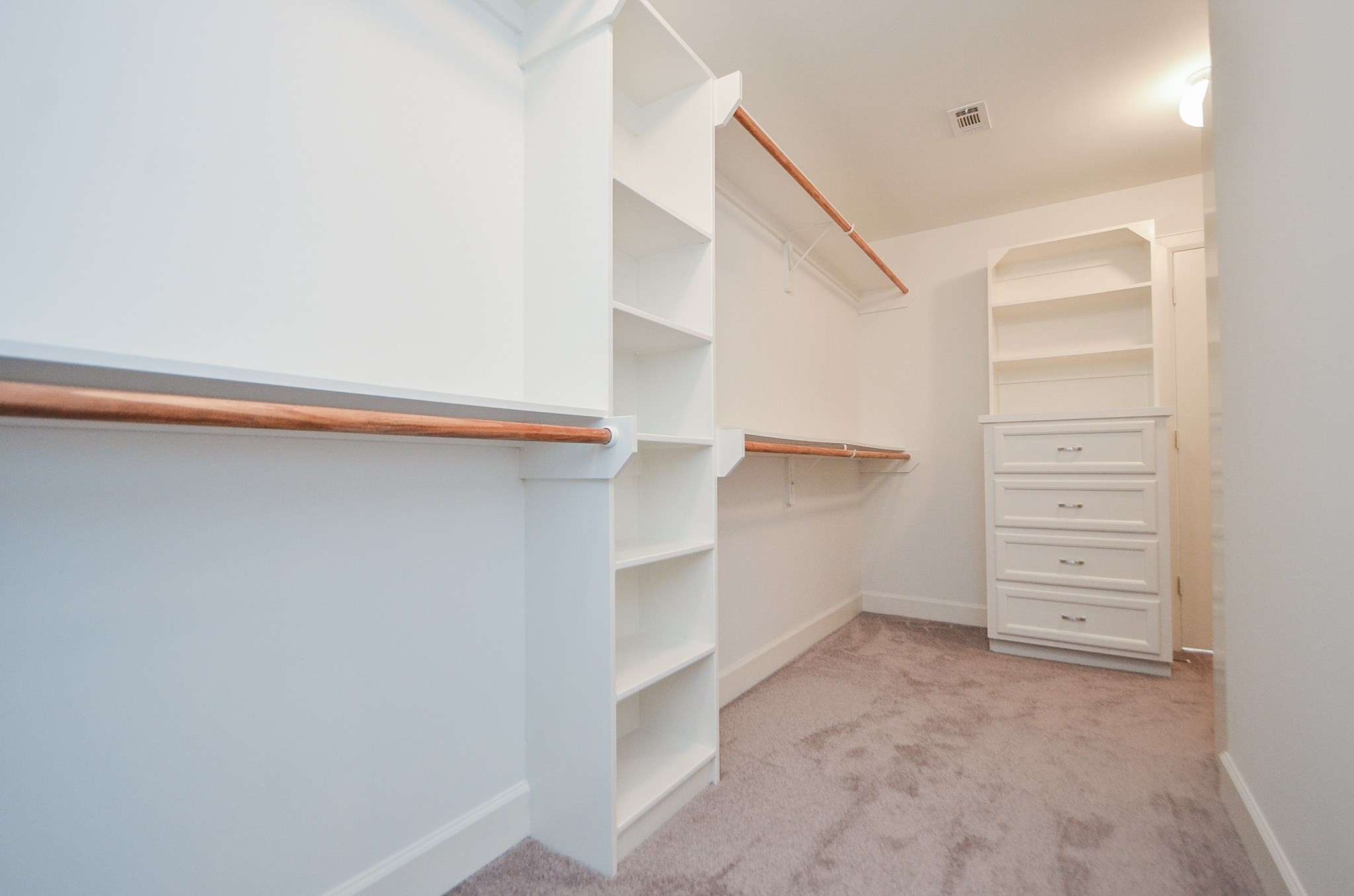 The other side of the closet with built ins throughout.