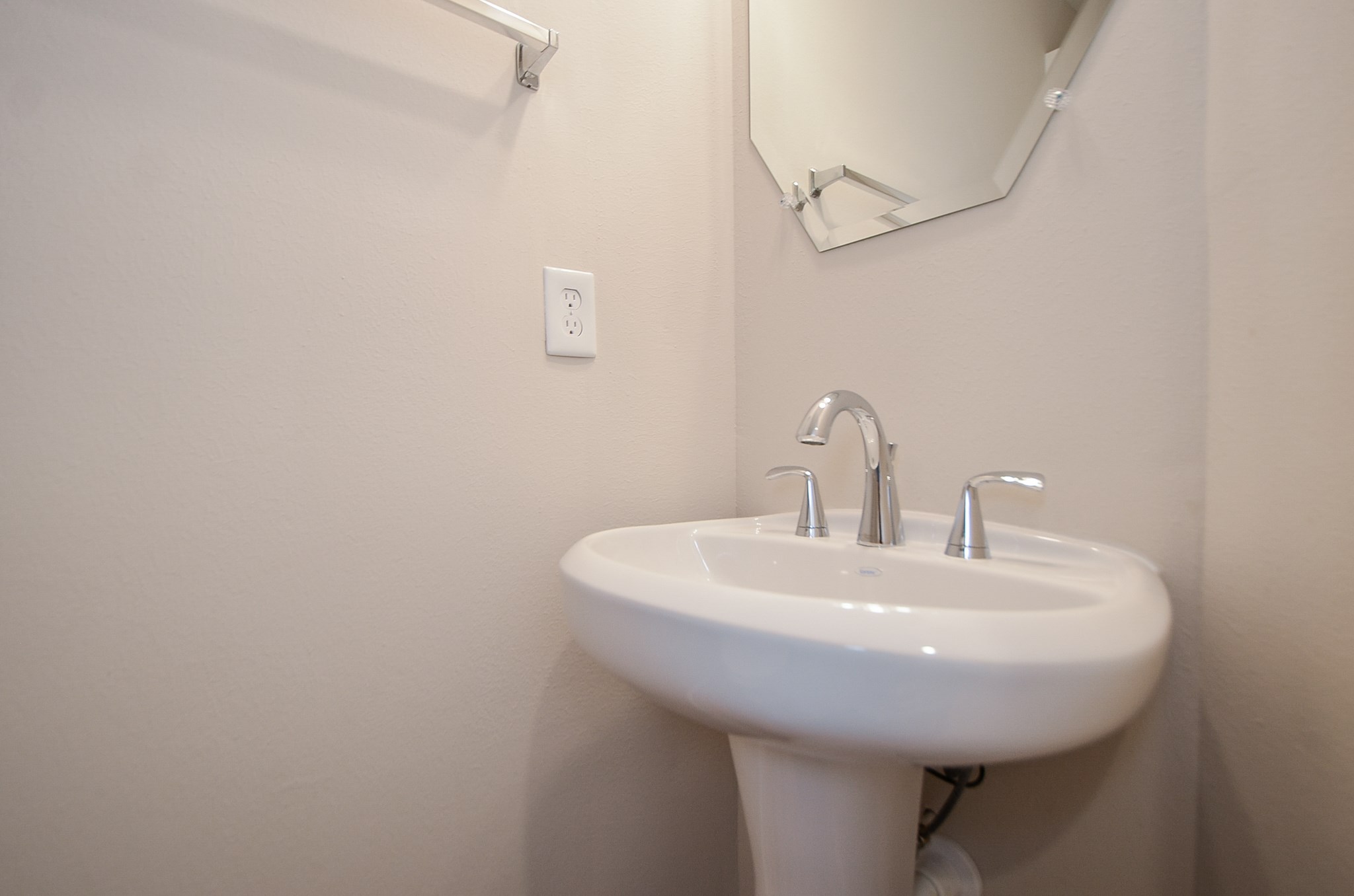 The first floor provides a half bath with a pedestal sink 





















































































































]