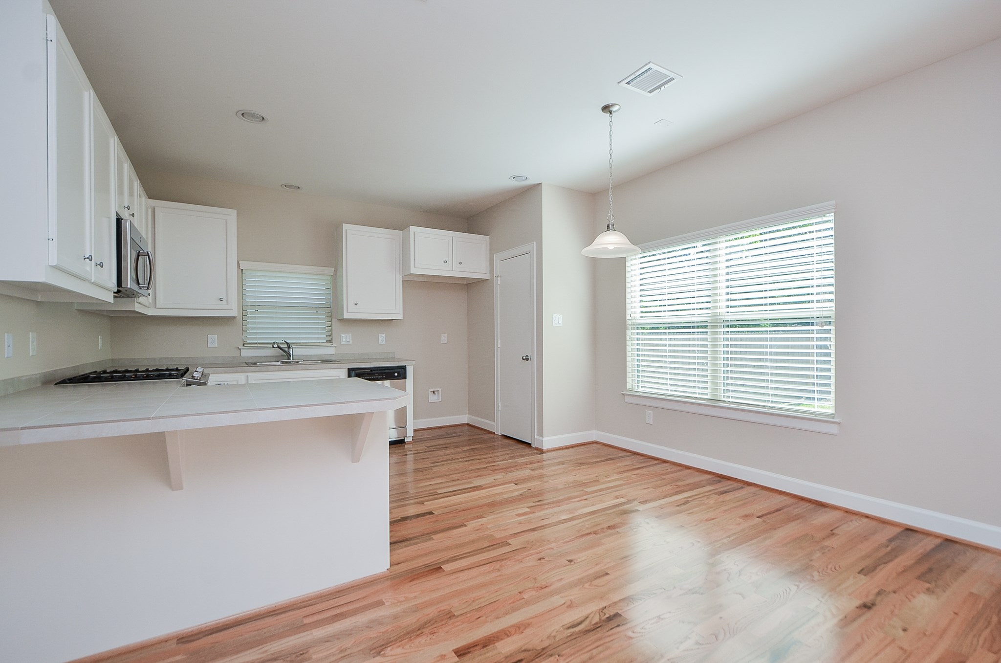 The kitchen area provides a breakfast bar as well as room for a breakfast table.  Please note that landlord will provide a refrigerator if tenant does not have their own.