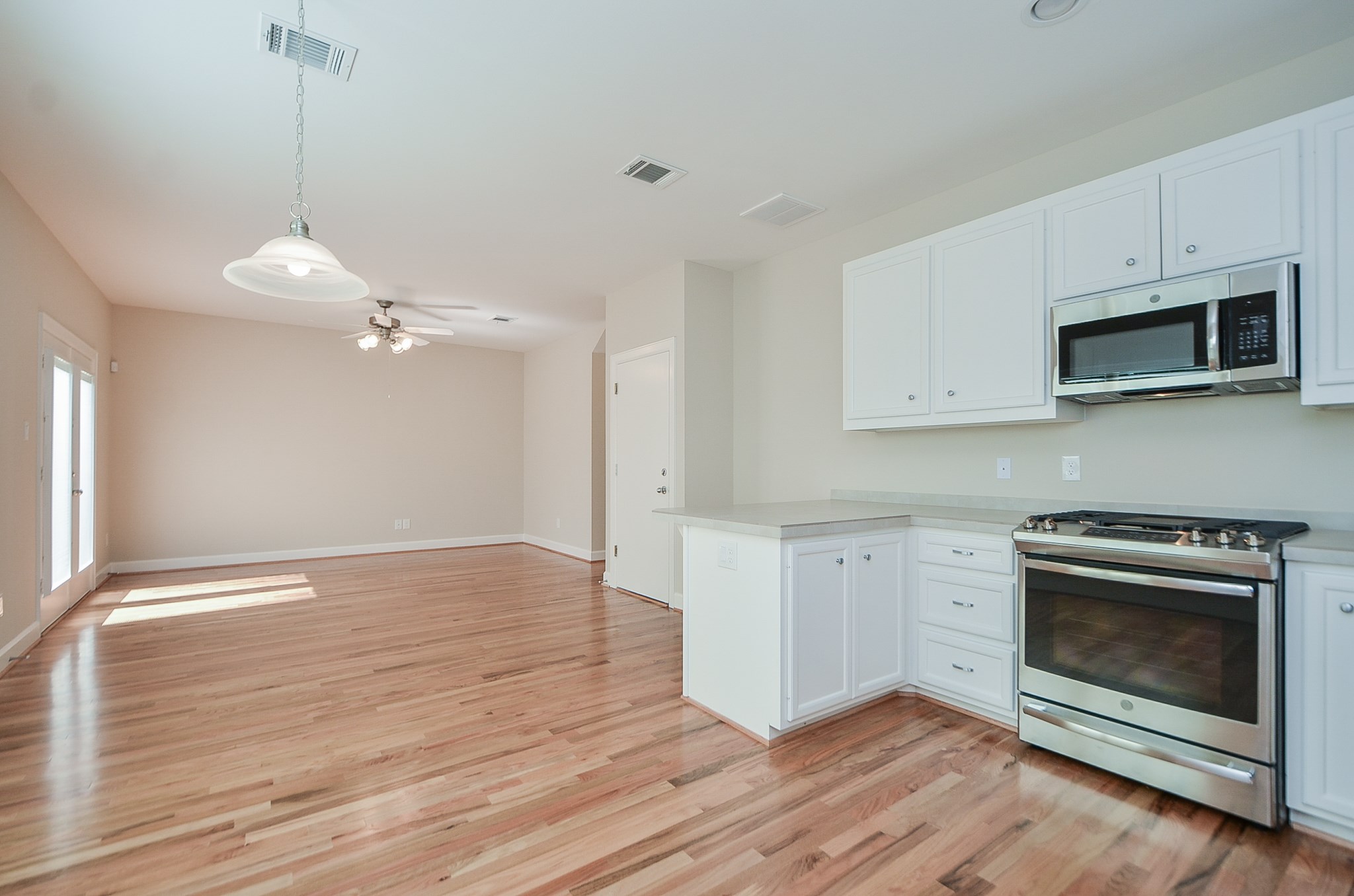 An additional view into the kitchen/breakfast/and living area.