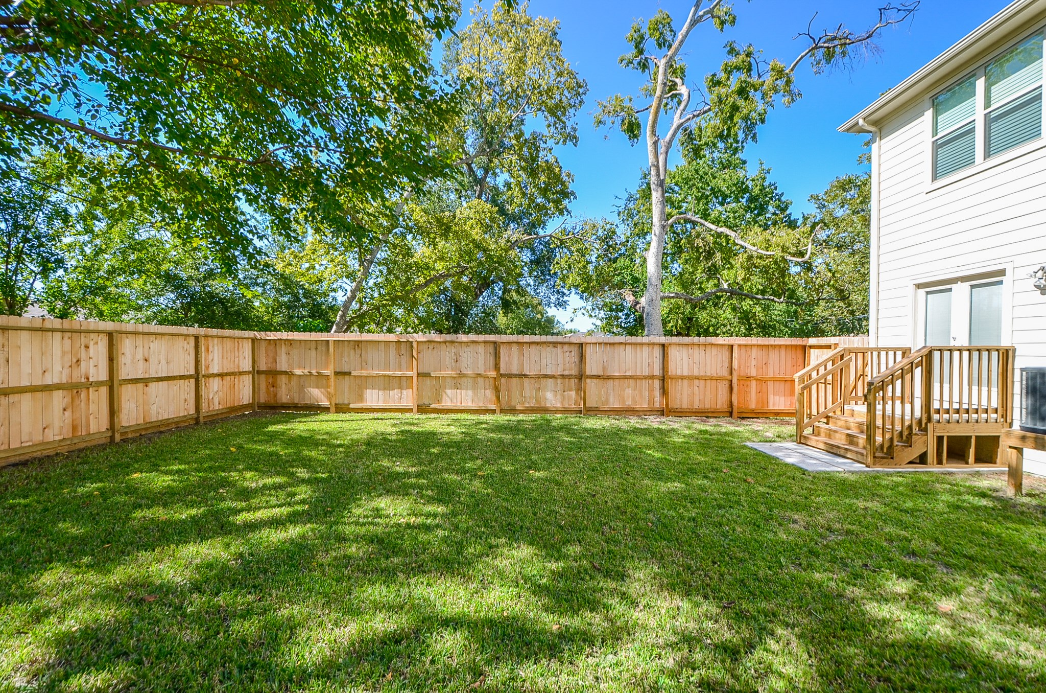 Additional backyard view.  Notice the raised elevation of the living area of the home.