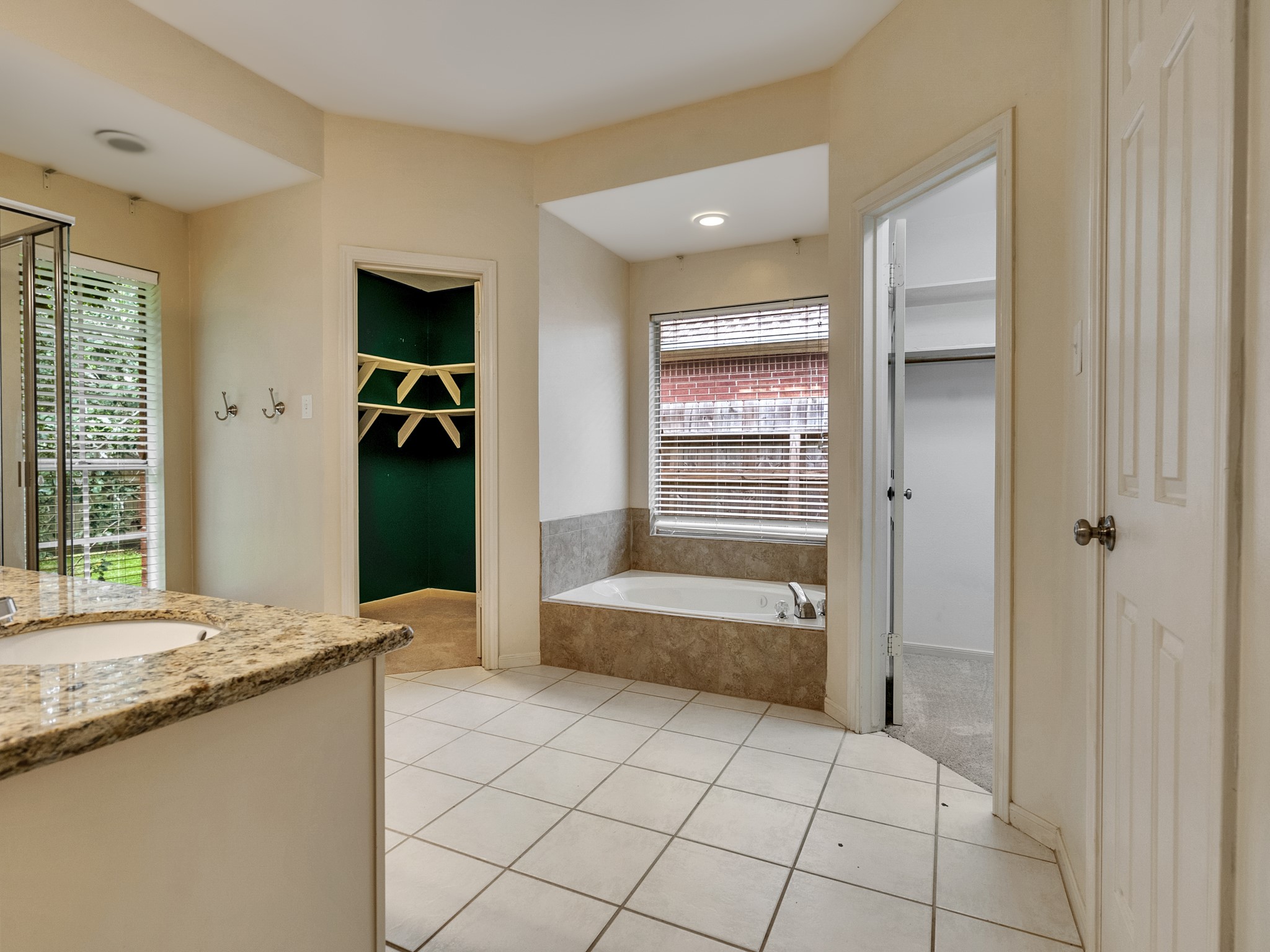 Primary Bath with his and her closets
