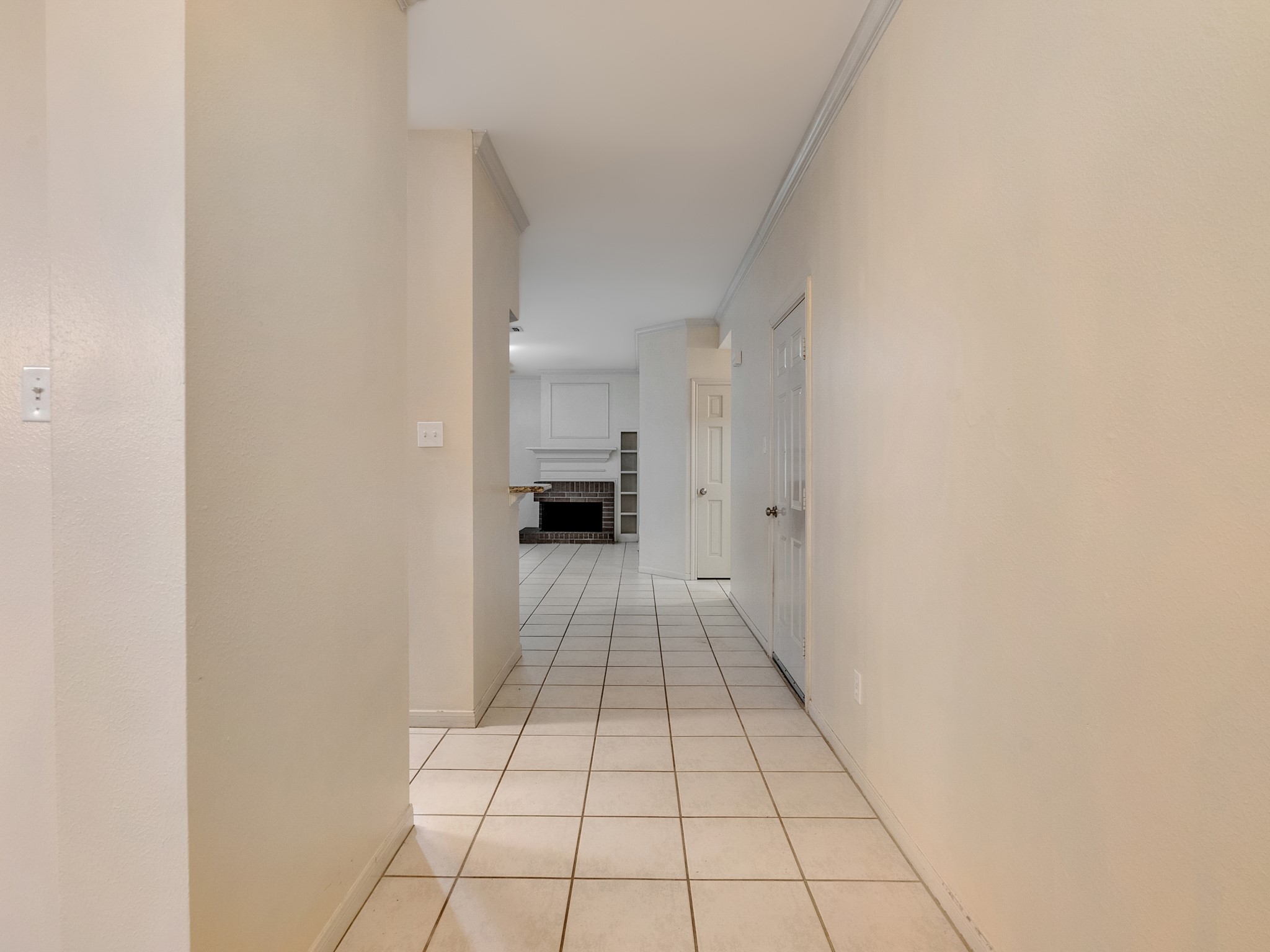 View from entry leading to the family room with the dining room and kitchen to the left and garage access to the right View from entry leading to the family room with the dining room and kitchen to the left and garage access to the right