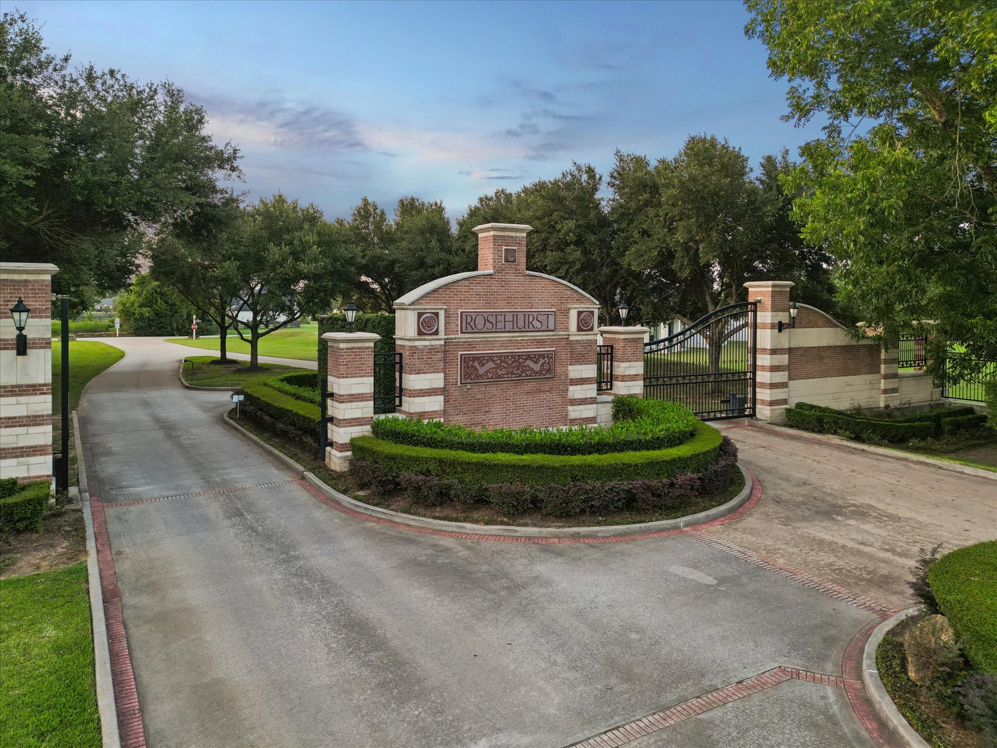Welcome to Rosehurst, an exclusive gated community where privacy, prestige, and estate-style living come together. Manicured landscaping, elegant brick architecture, and controlled access create a grand first impression, setting the tone for the exceptional lifestyle that awaits beyond the gates. Nestled among towering trees and expansive homesites, this sought-after neighborhood offers a tranquil retreat just moments from modern conveniences.