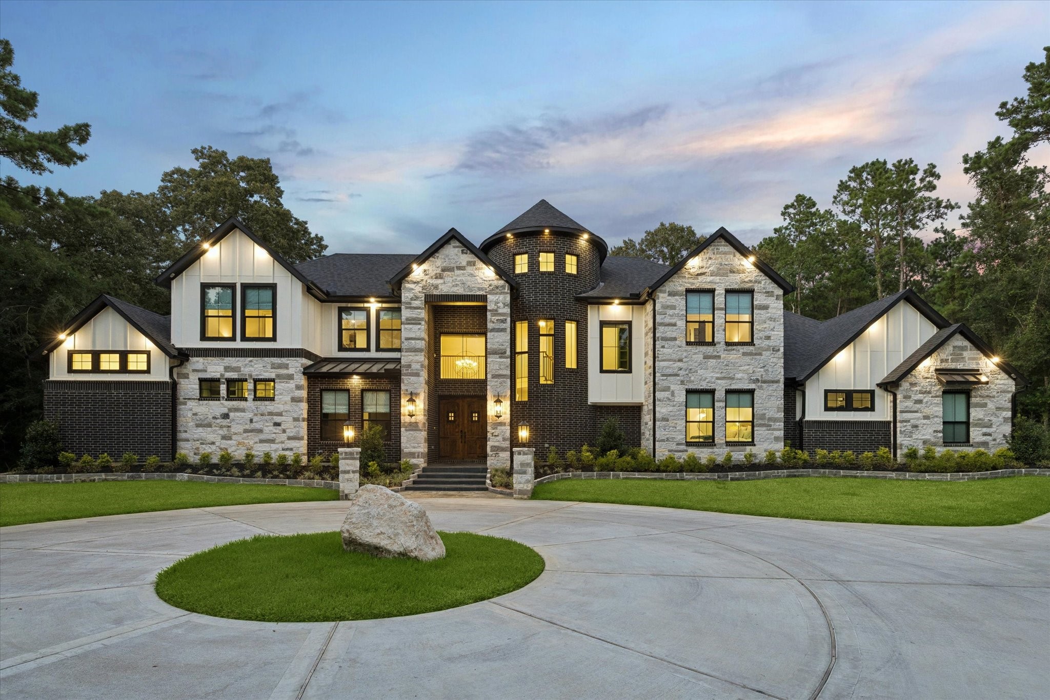 Commanding attention from the moment you arrive, this extraordinary custom estate showcases timeless architecture, striking stone and brick accents, and dramatic rotunda-inspired design. Completed in 2026 and situated on approximately 1.8 private wooded acres, the residence offers over 5,500 square feet of thoughtfully curated living space, blending sophisticated craftsmanship with luxurious modern amenities and exceptional curb appeal.