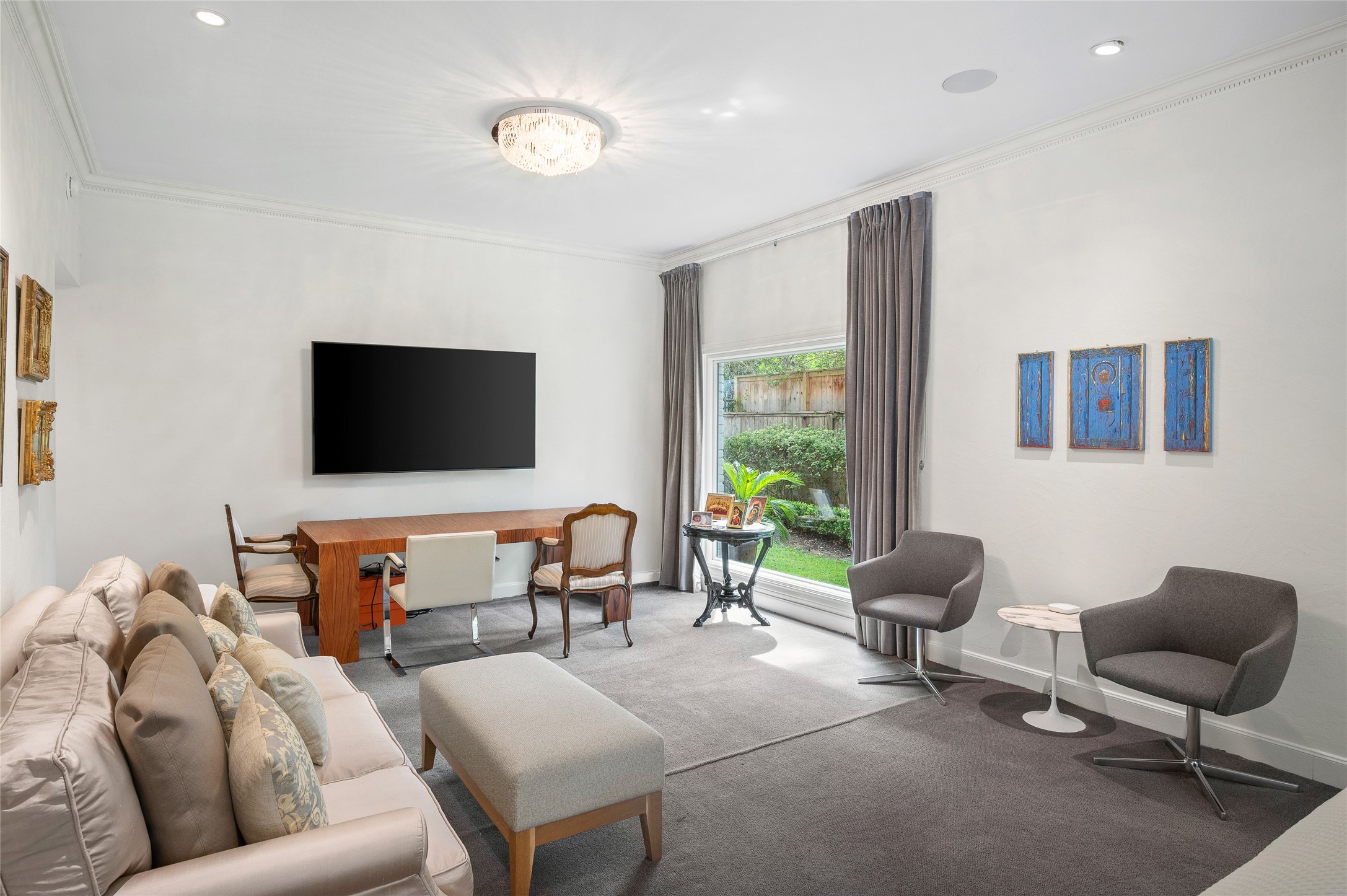 [Primary Suite]
A mount for flat-screen TV faces sitting area in the bedroom.