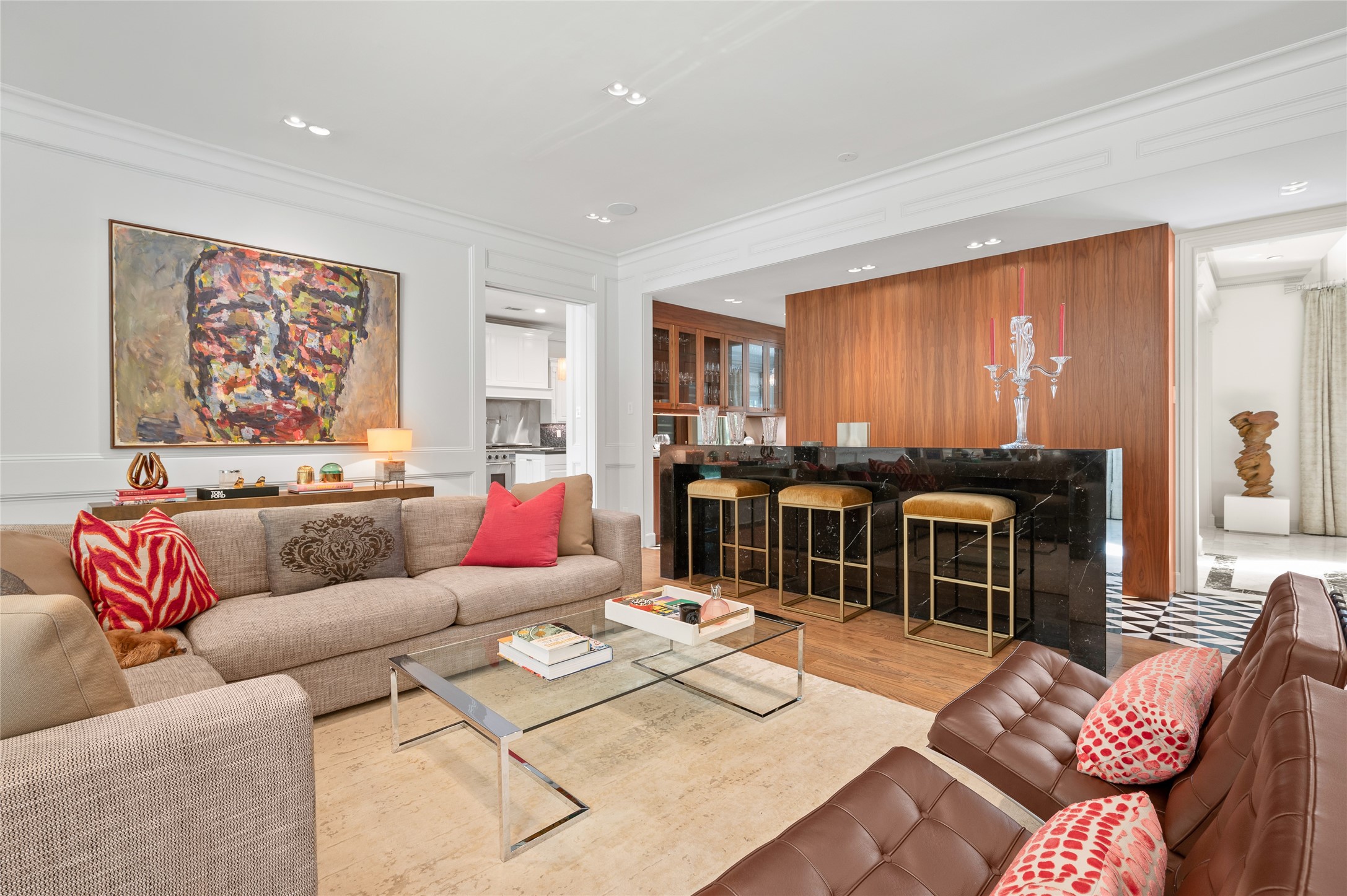 [Family Room]
This view travels from the family room into the bar and, at rear, the foyer.