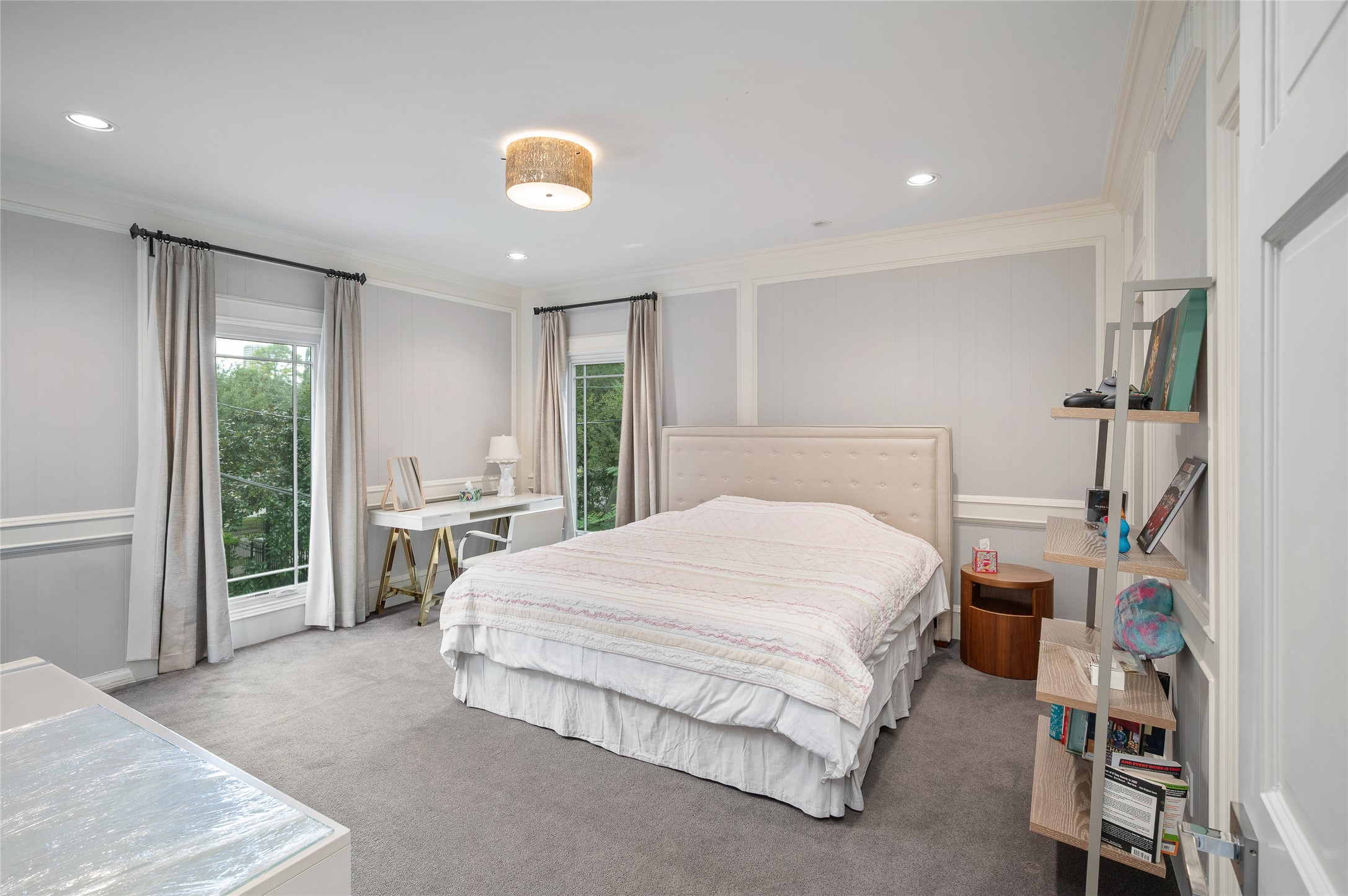[En Suite Bedroom]
Carpeted bedrooms on the second floor are en suite and have custom-fitted closets. Note full-length windows and wall molding.