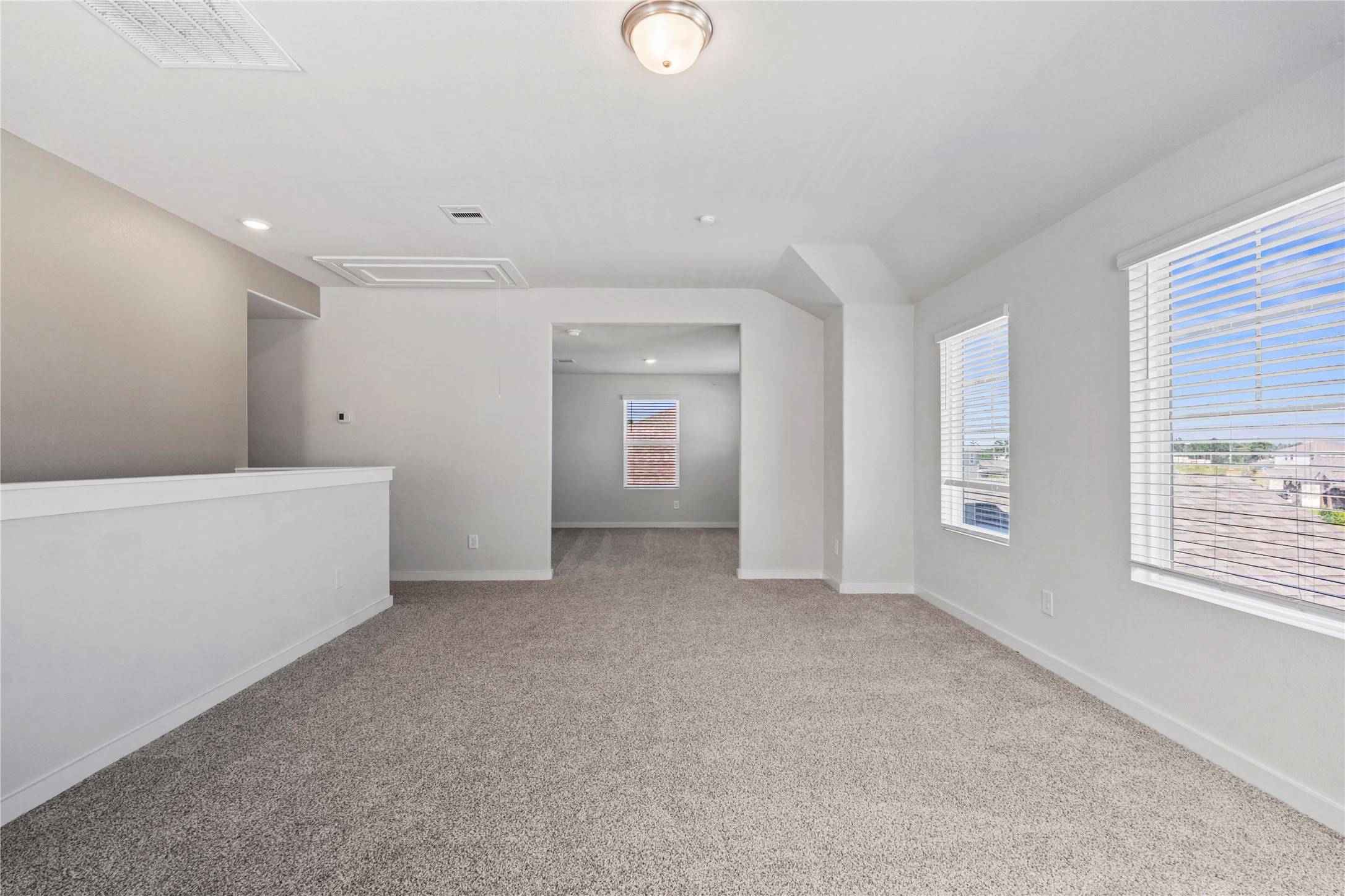 View of the game room and flex space upstairs.