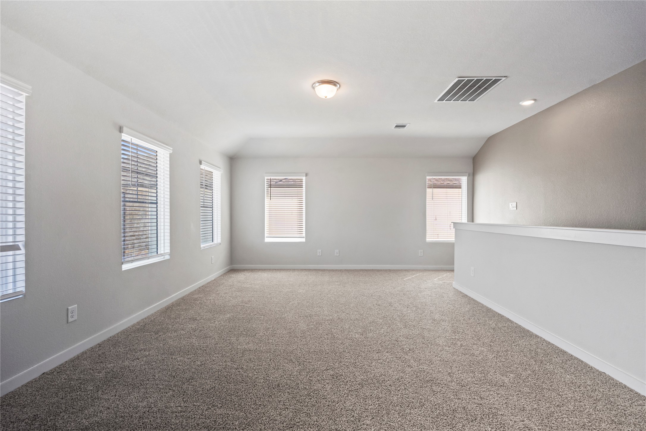 The game room area and a view of the staircase to the right.