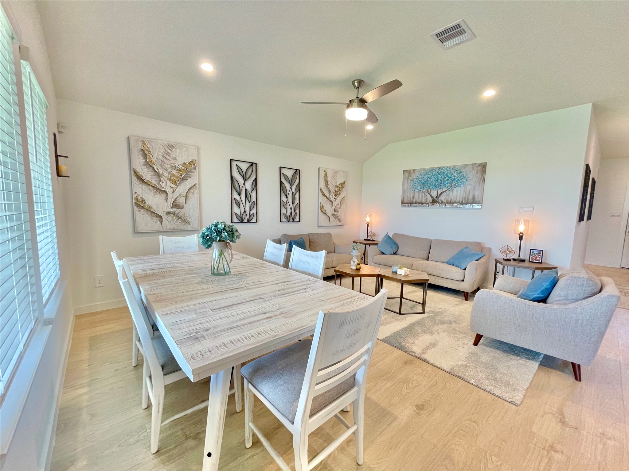 Host unforgettable dinners in this dedicated dining zone, beautifully framed by elegant wall decor and plenty of natural light.