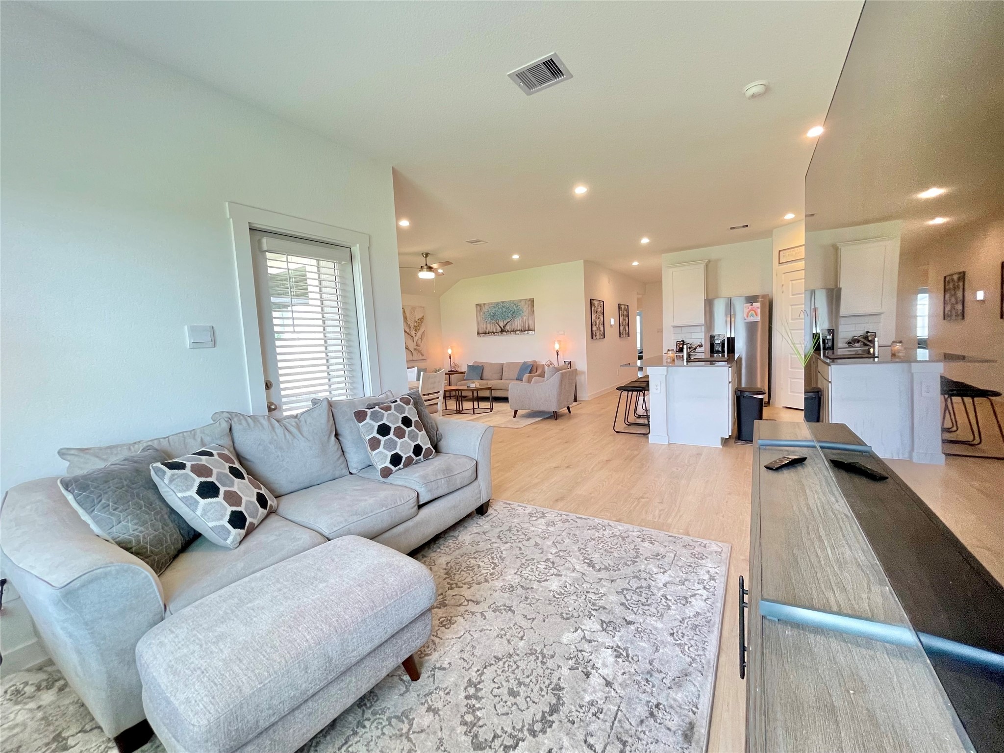 Generously sized secondary family room offering endless versatility for a massive sectional, playroom setup, or media center.