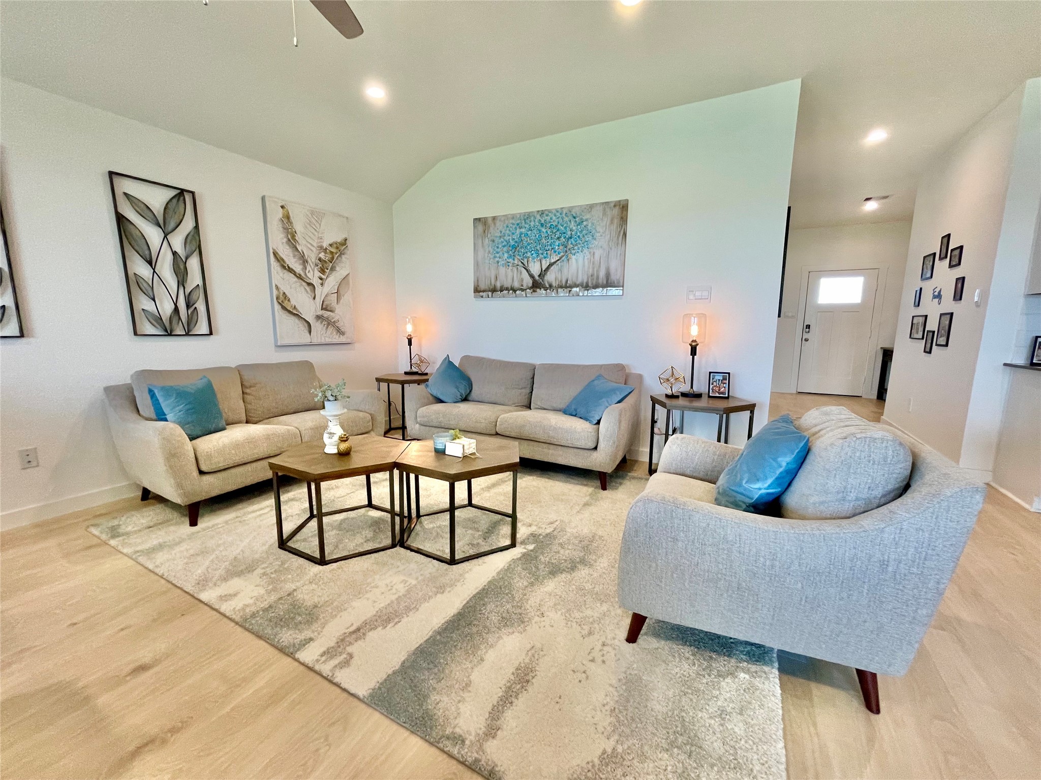 The ultimate gathering spot! Relax in style within this beautifully appointed living room, boasting plush seating and a crisp, modern palette.