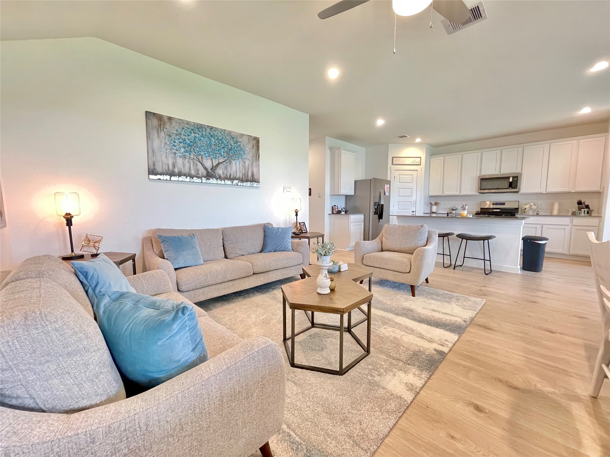 Magnificent open-concept layout that effortlessly blends the main living room, dining area, and kitchen into one grand entertaining space.