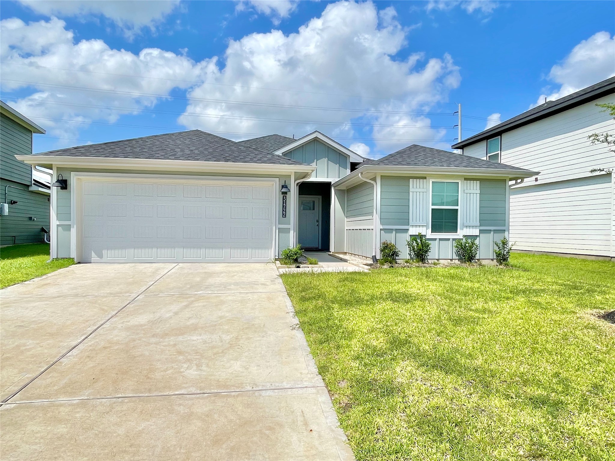 Welcome home! Exceptional curb appeal shines through this pristine, modern single-story residence, complete with a manicured lawn and a spacious driveway.