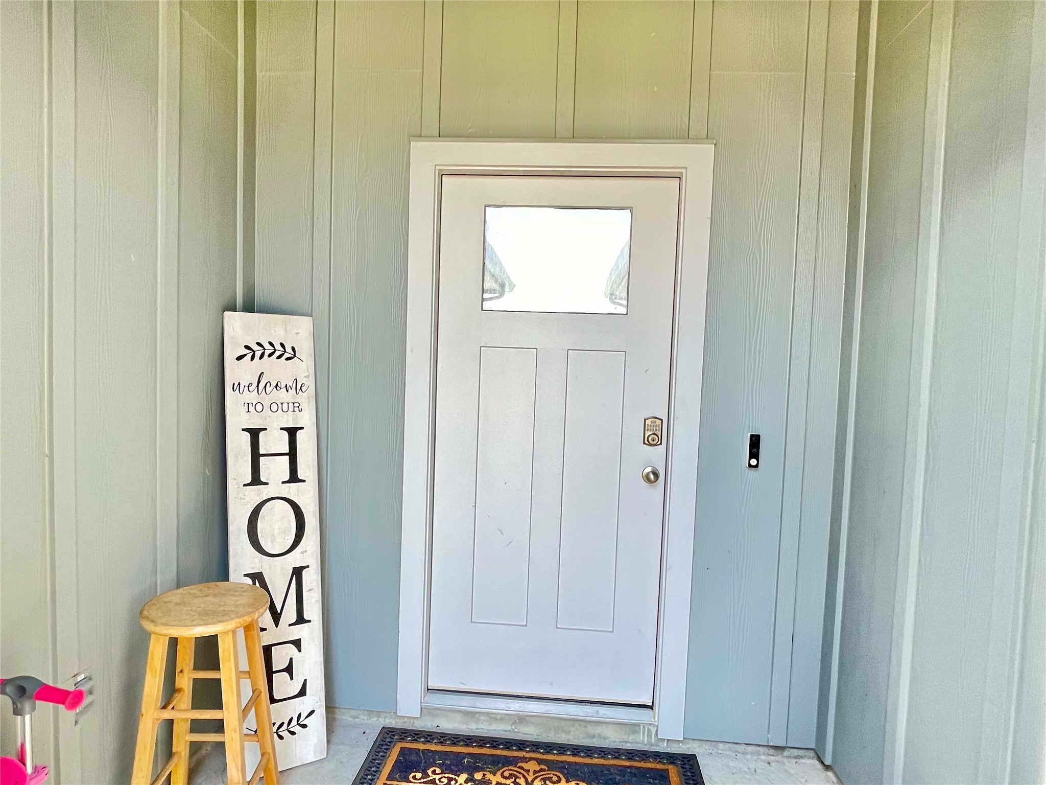 A warm and charming front porch sets the perfect tone, welcoming guests with an inviting, cozy atmosphere right at the front door.
