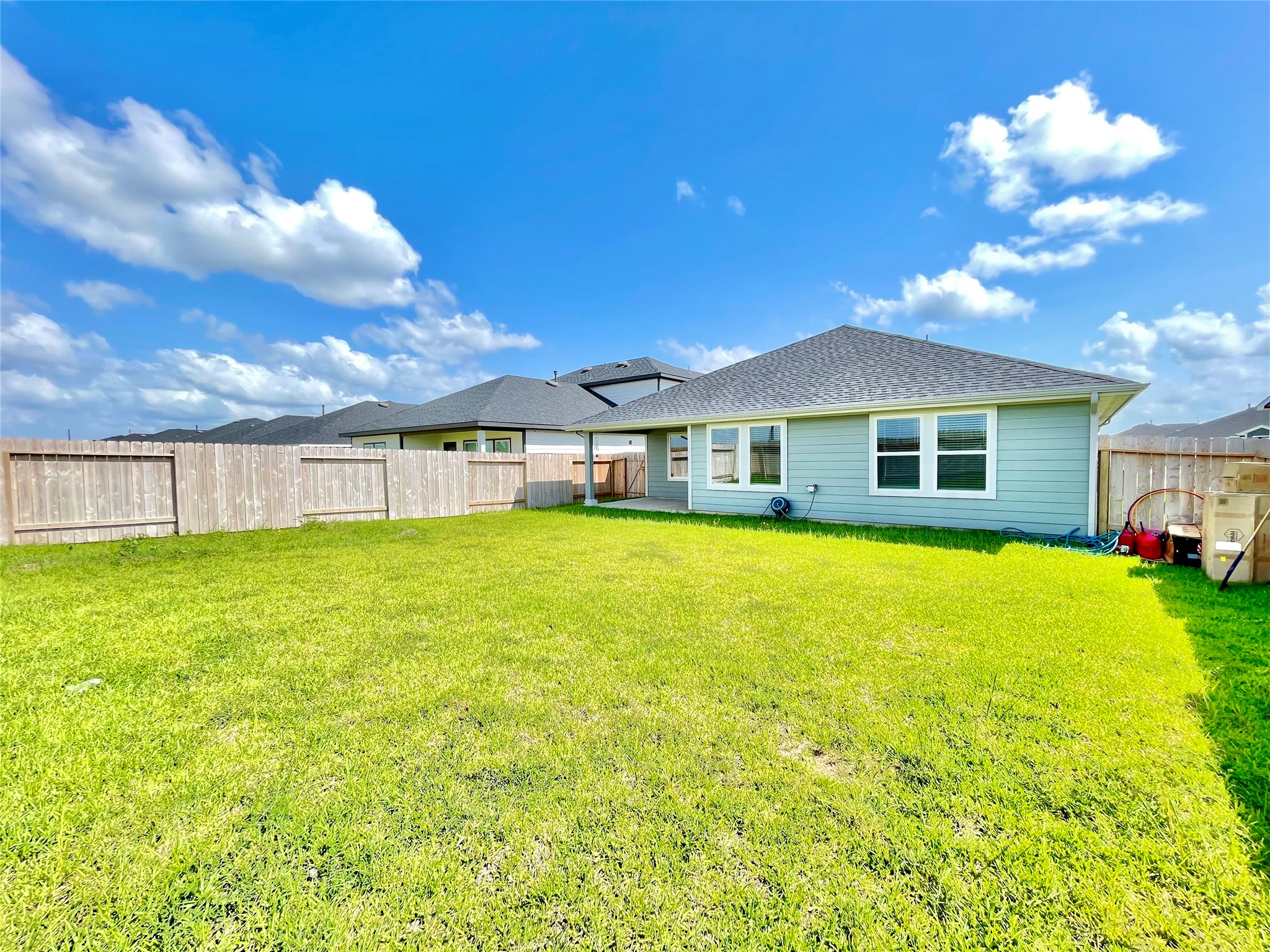 Soak in the blue skies! This wide-angle perspective showcases the ultimate privacy and space of your outdoor sanctuary.