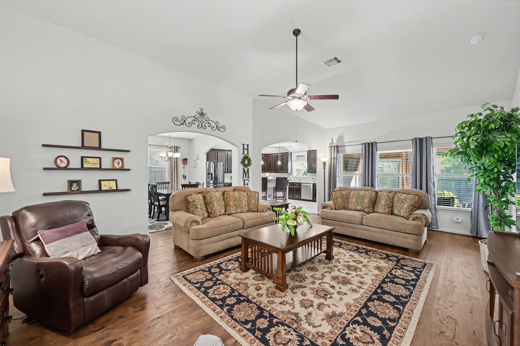 Spacious living room with engineered hardwood floors.