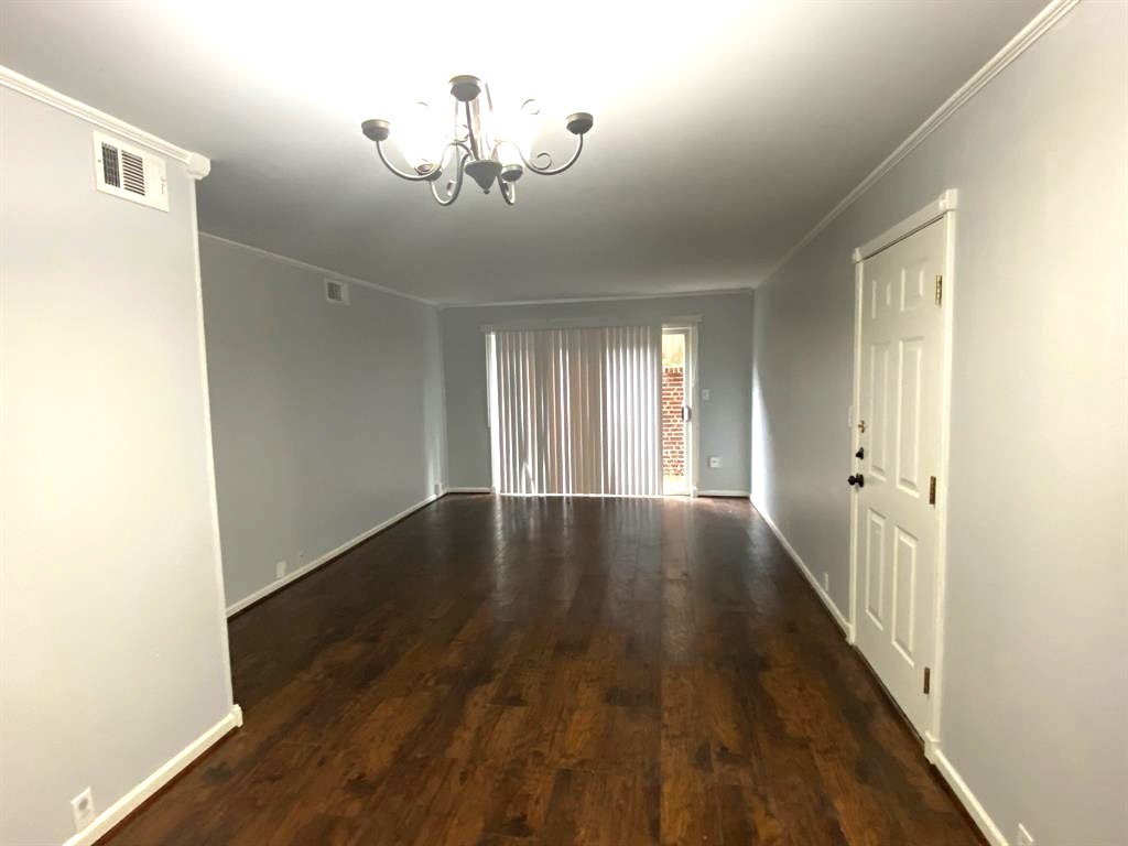 Living room with access to private patio