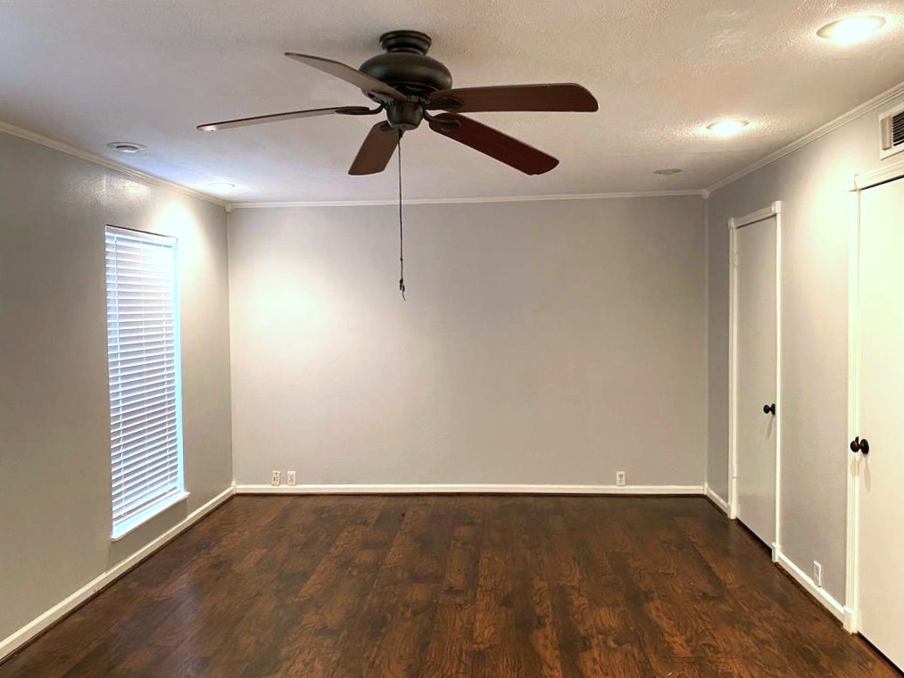 Large Bedroom with ceiling fan and three closets
