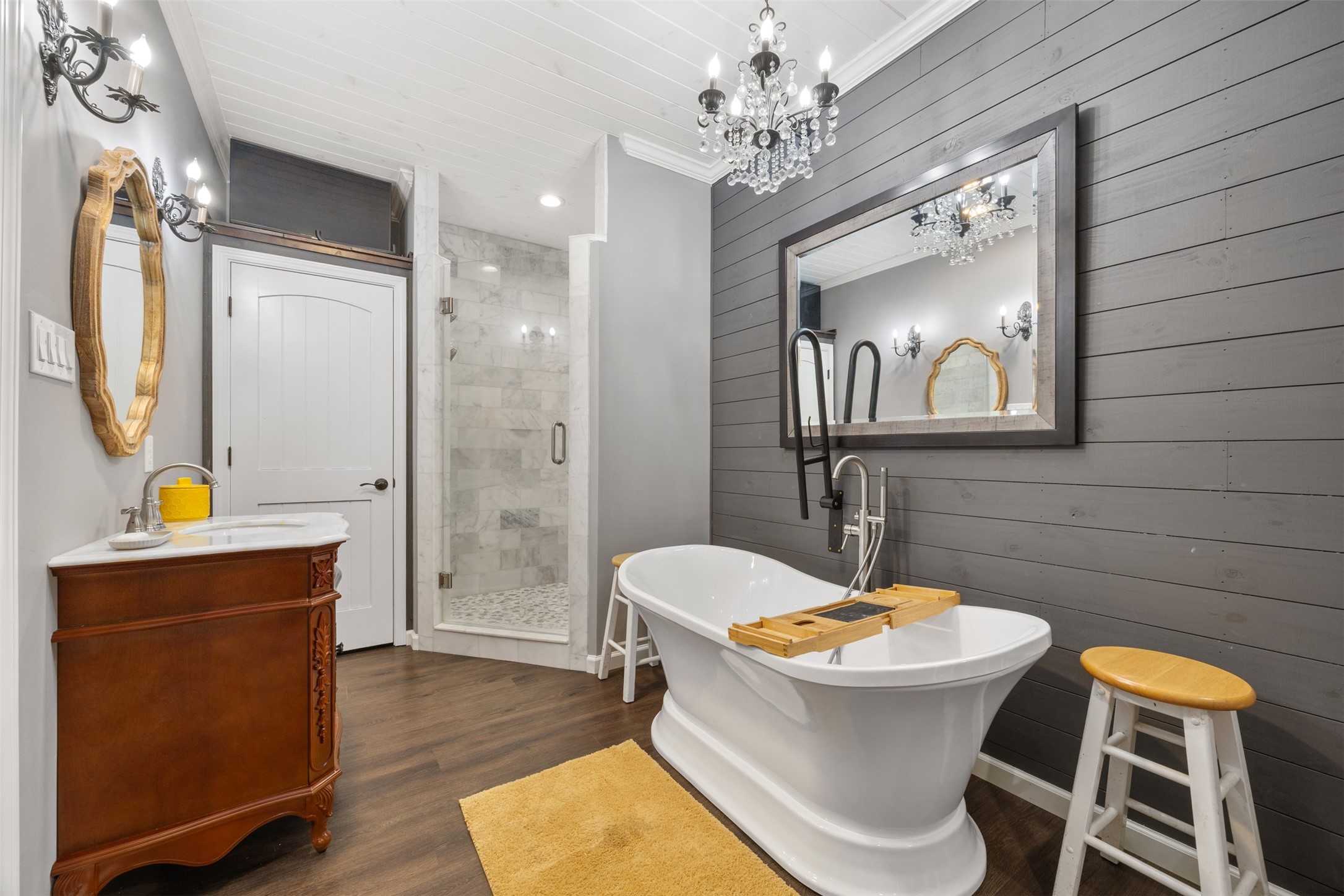Who doesn't want to soak in this new bath tub in the primary bathroom. The shower is brand new. The chandeliers and lighting fixtures just make this shine