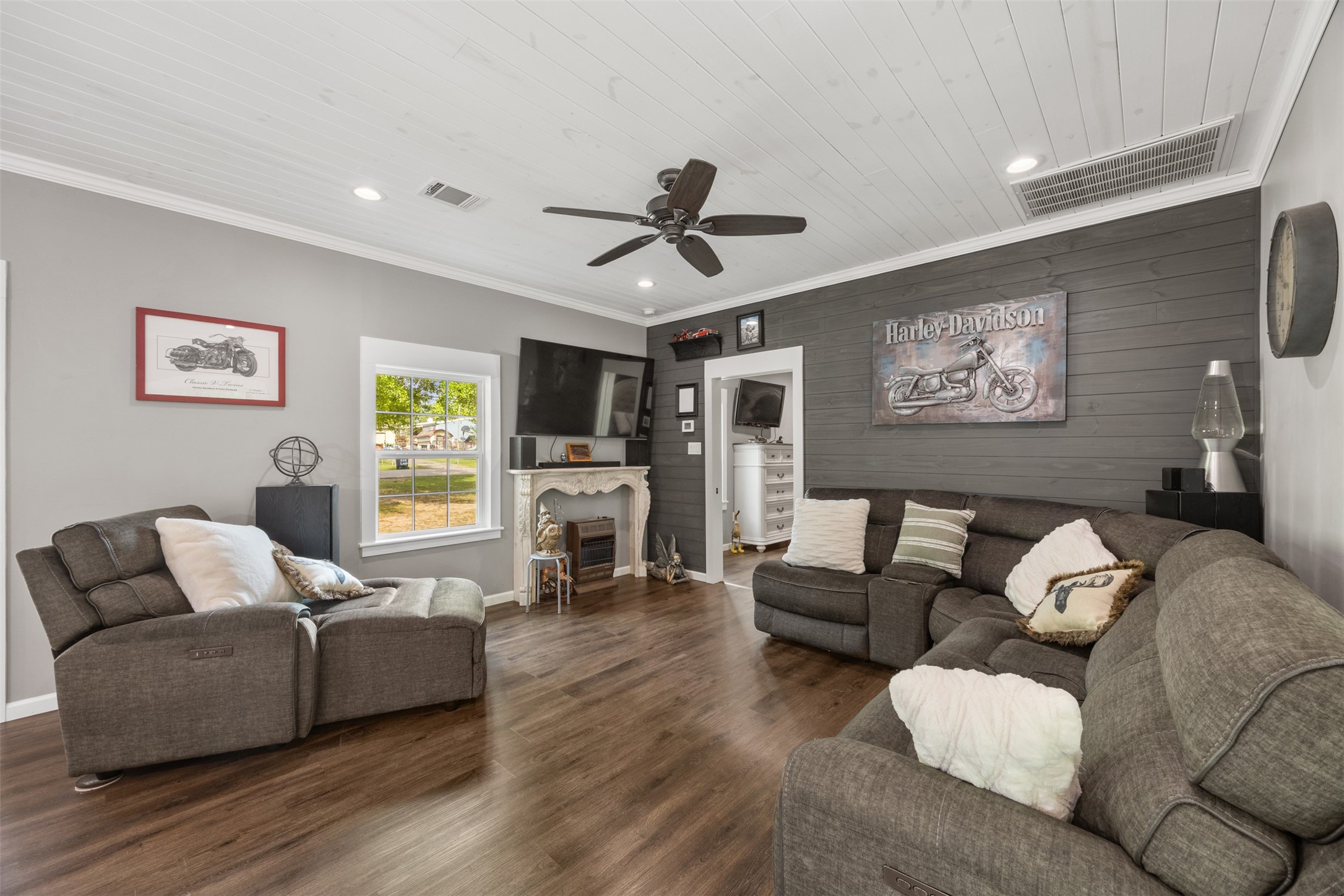 With beautiful shiplap walls, the family room connects with the open eat in kitchen. Flooring throughout is new luxury vinyl.