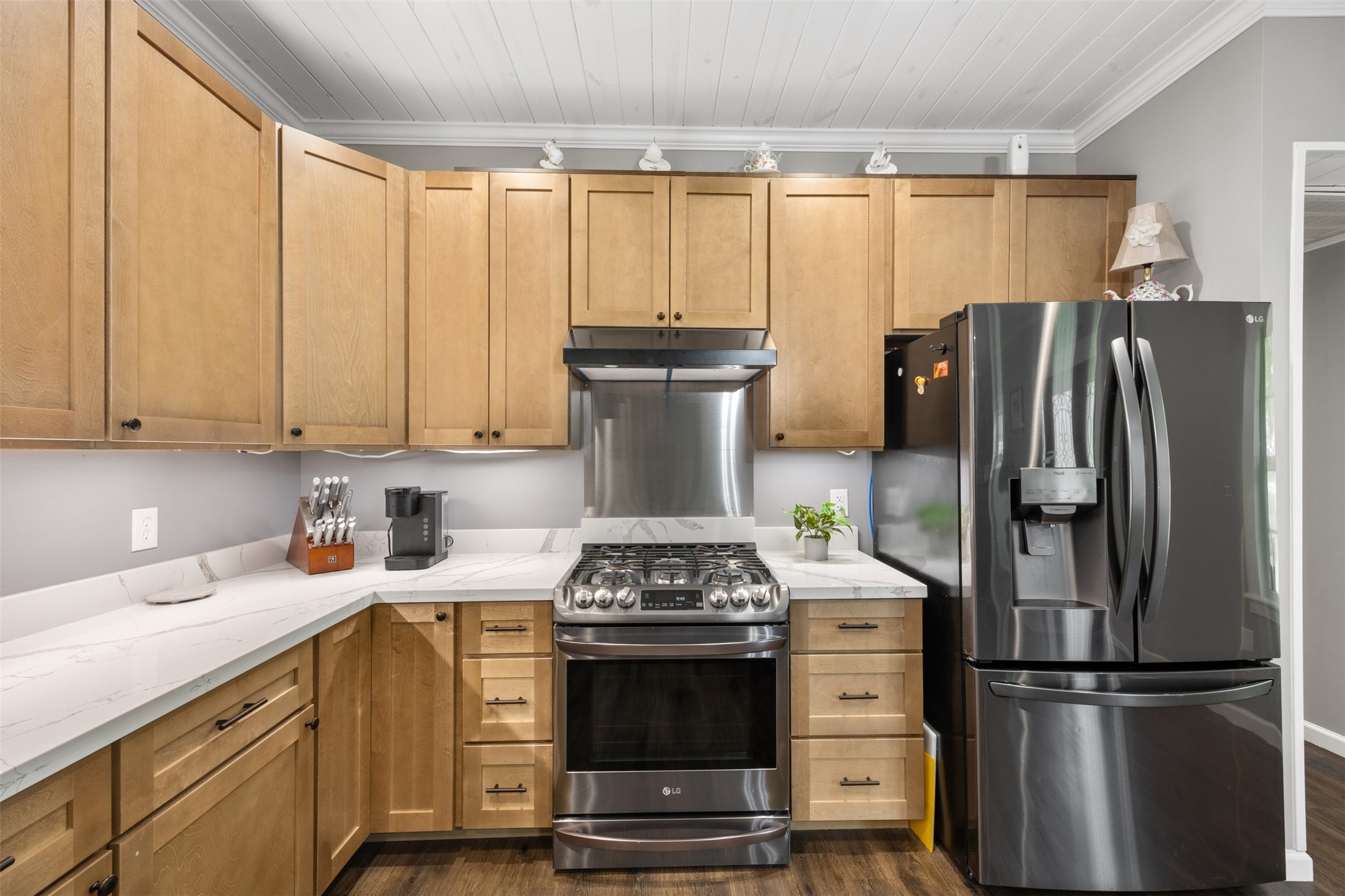 New wood cabinetry and counter top. The refrigerator stays with the home