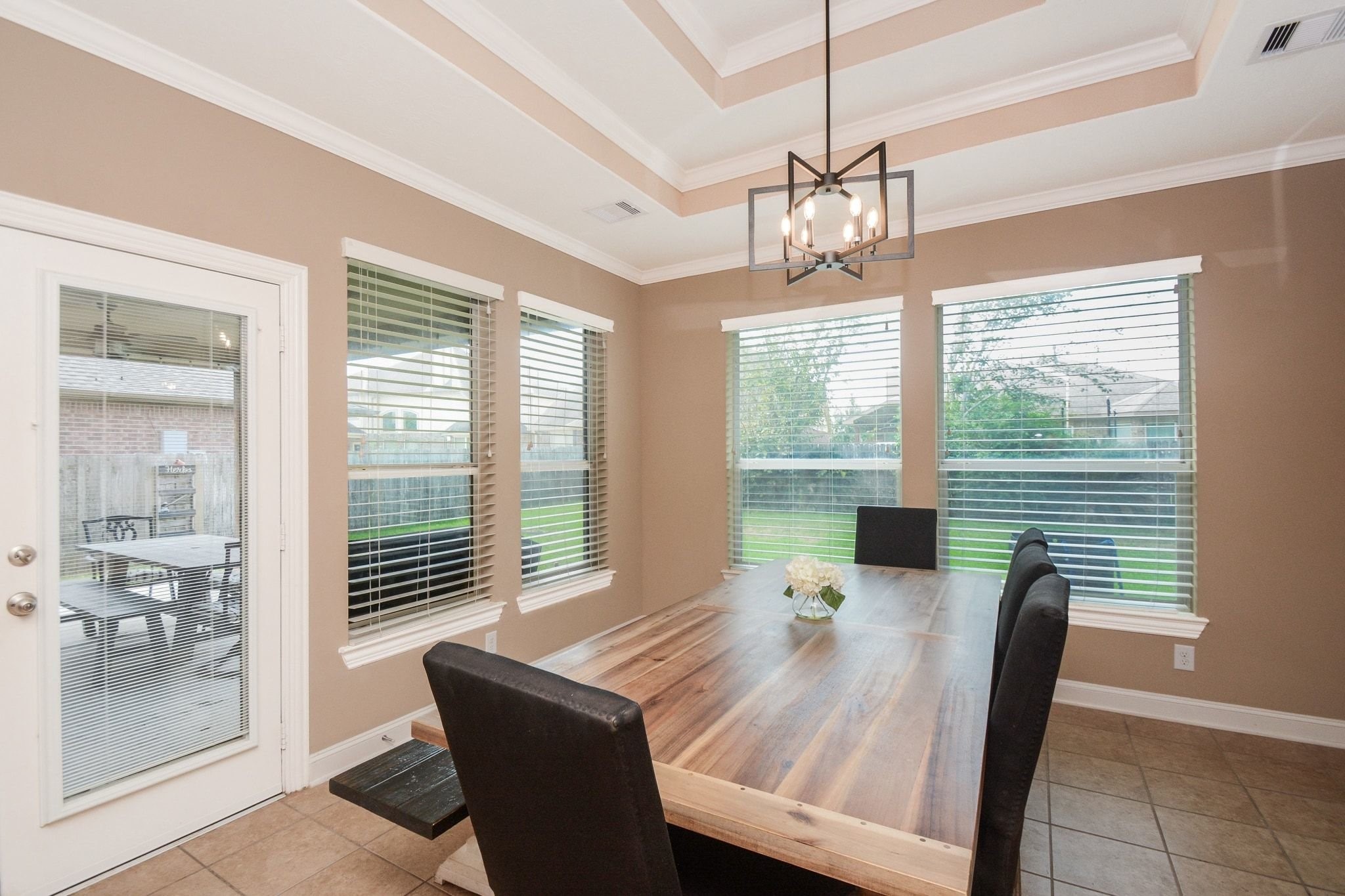 Large dining area with views to the backyard and large covered patio.