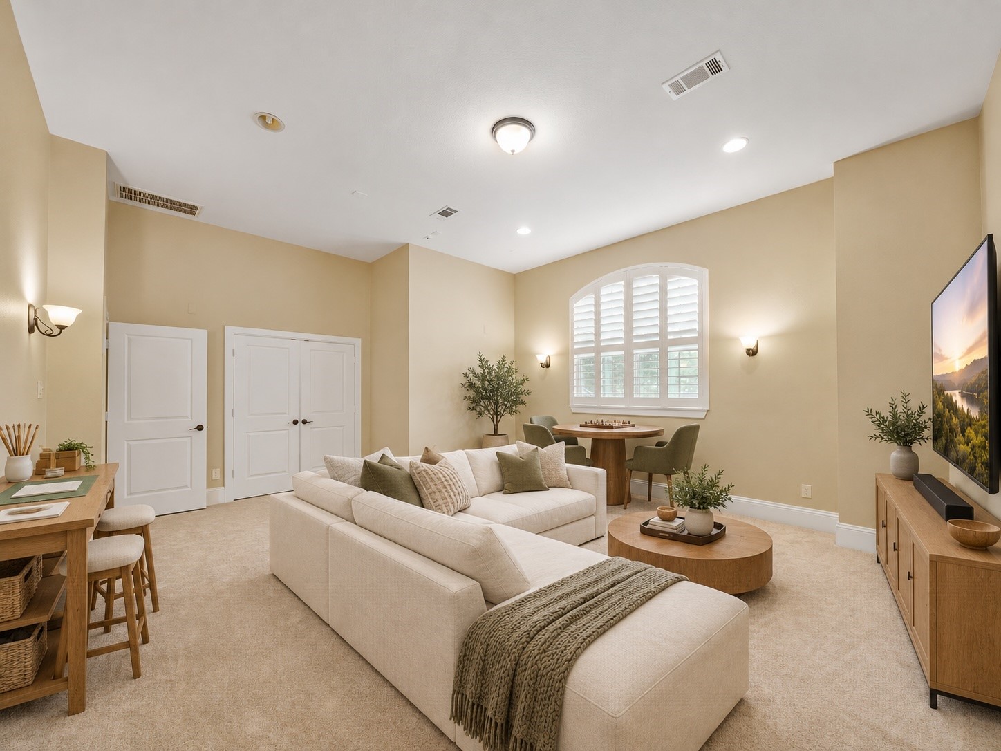 Virtually staged: With space for movie nights, board games, and creative pursuits, this upper-level room shows its ability to grow with the household.