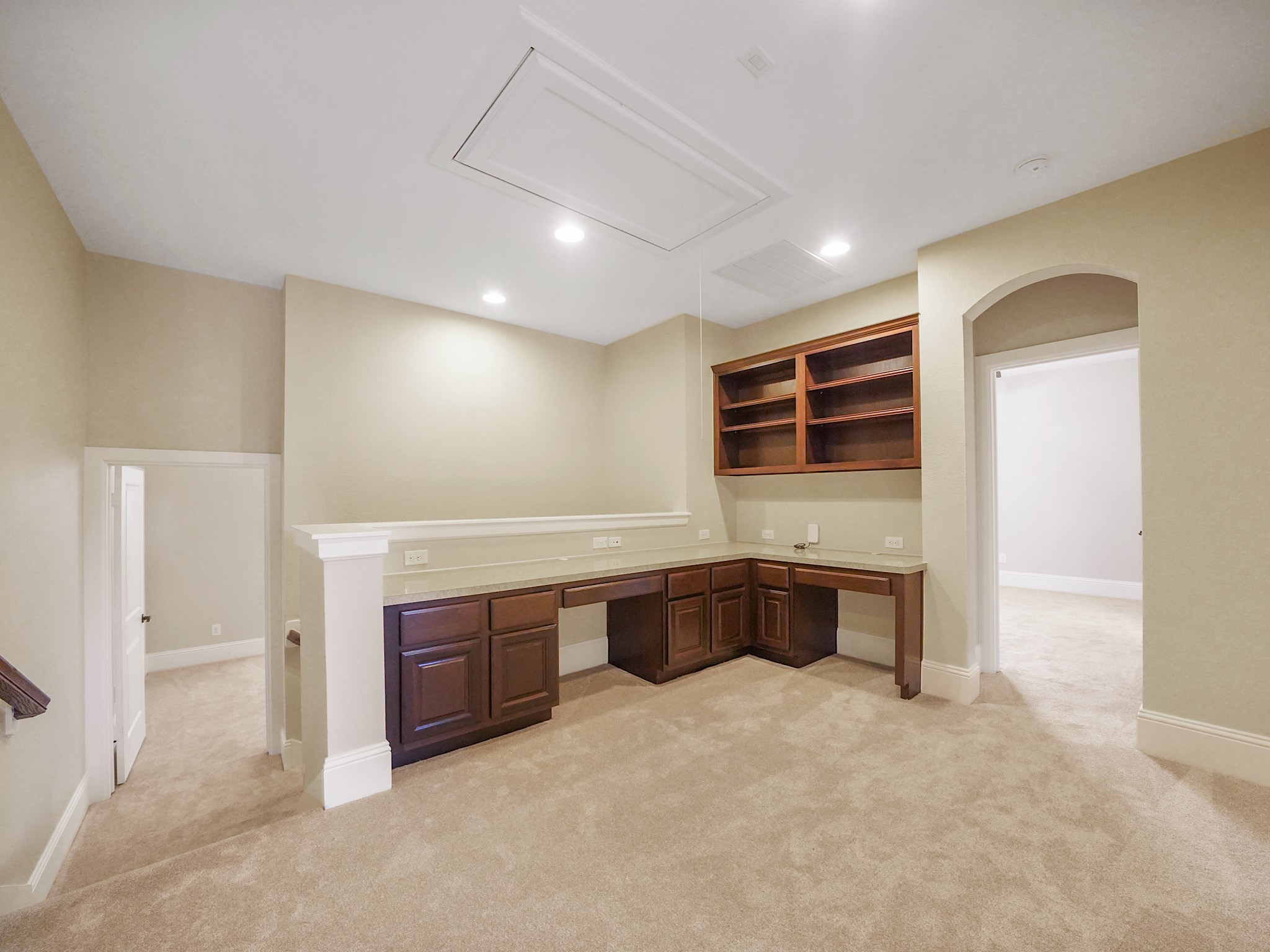 Upstairs, a built-in workstation creates a purposeful corner for homework, projects, or a quiet day of work.