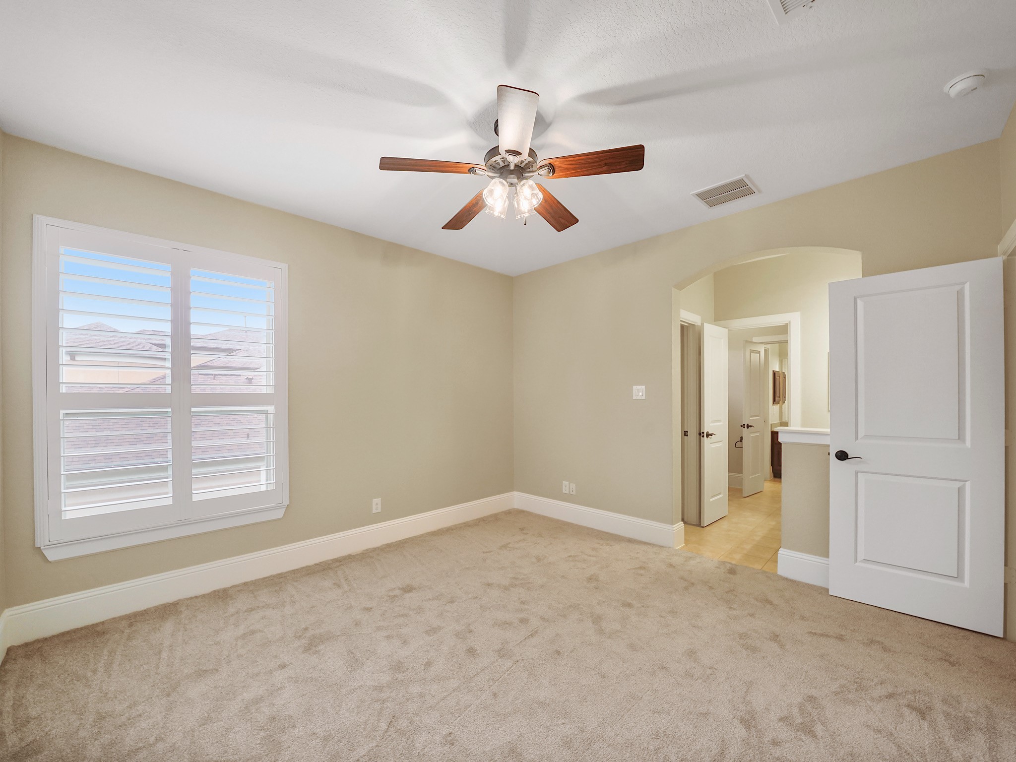 One of the secondary bedrooms enjoys a connected Jack-and-Jill bath, making it comfortable for family, guests, or a shared setup.