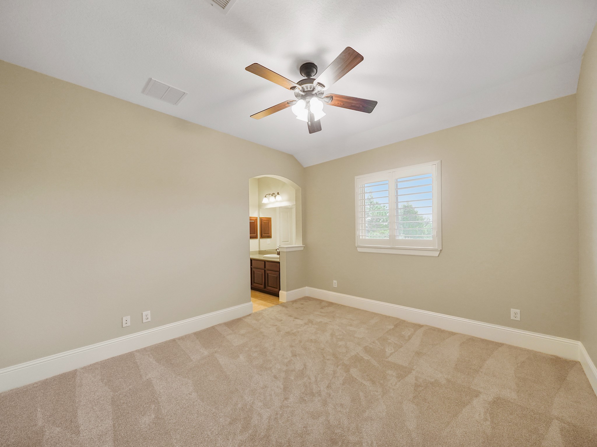 Another bright secondary bedroom offers a versatile blank canvas for changing needs.