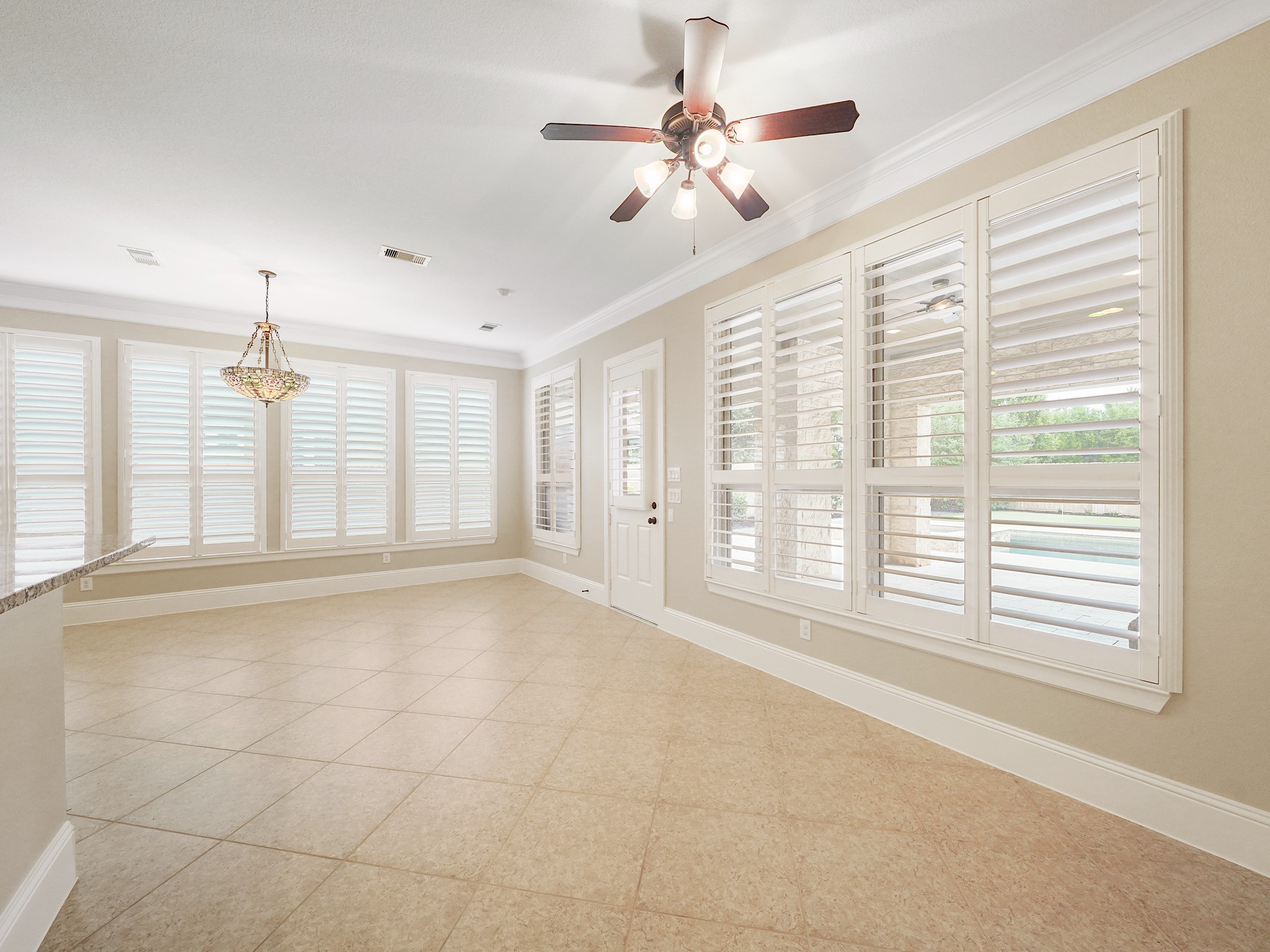 Bathed in natural light, the breakfast area is equally inviting as a cozy sunrooman easy place for slow mornings and an afternoon read.