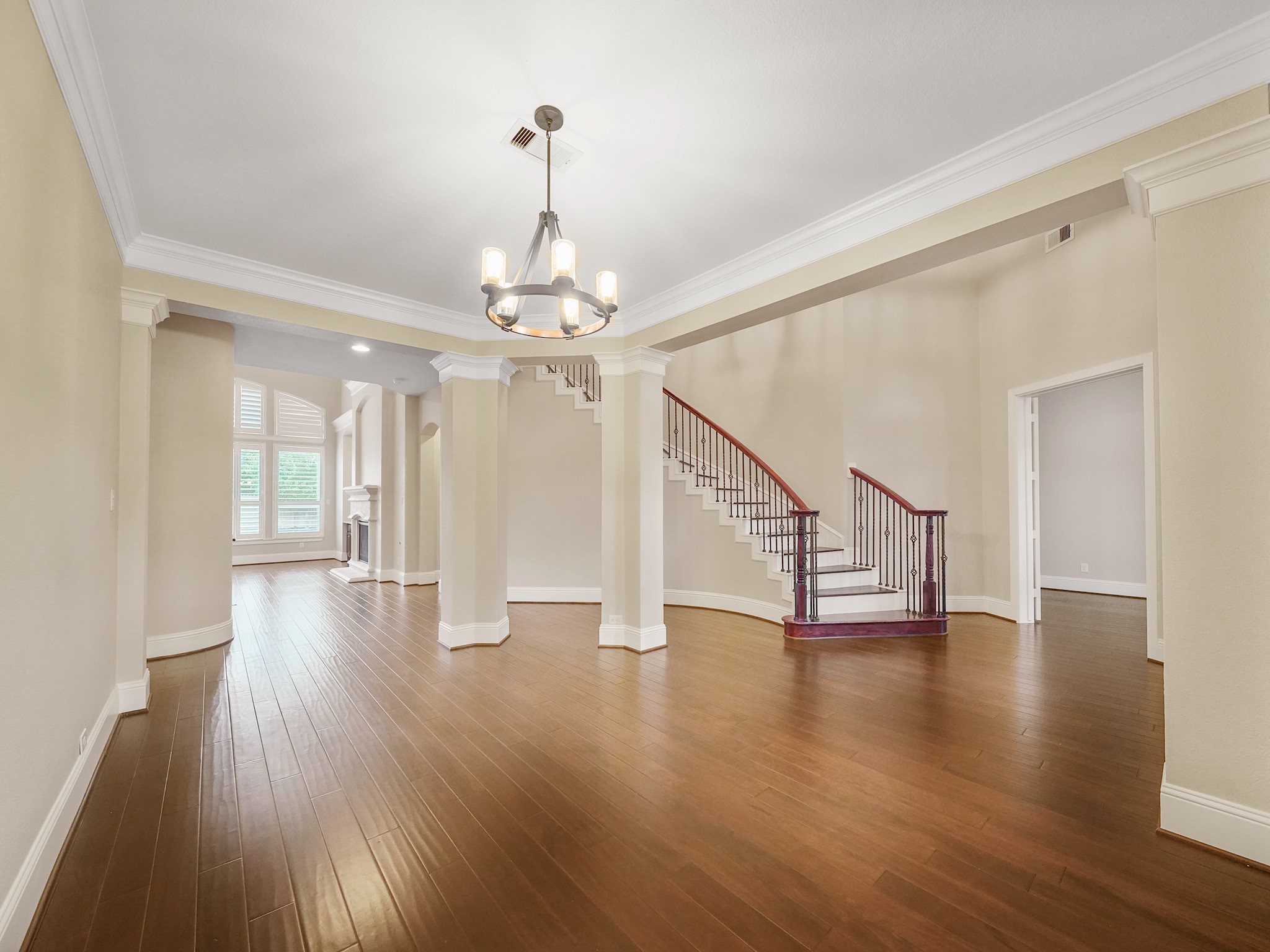 From this angle, the dining rooms graceful connection to the foyer and family room becomes part of the homes natural flow.
