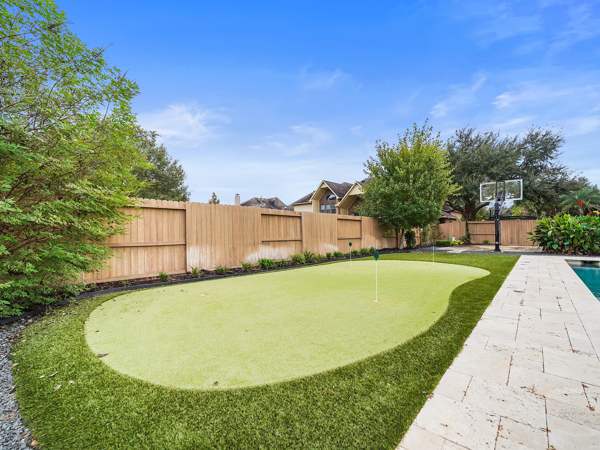 For a little friendly competition, the putting green brings a playful touch to the expansive lawn.