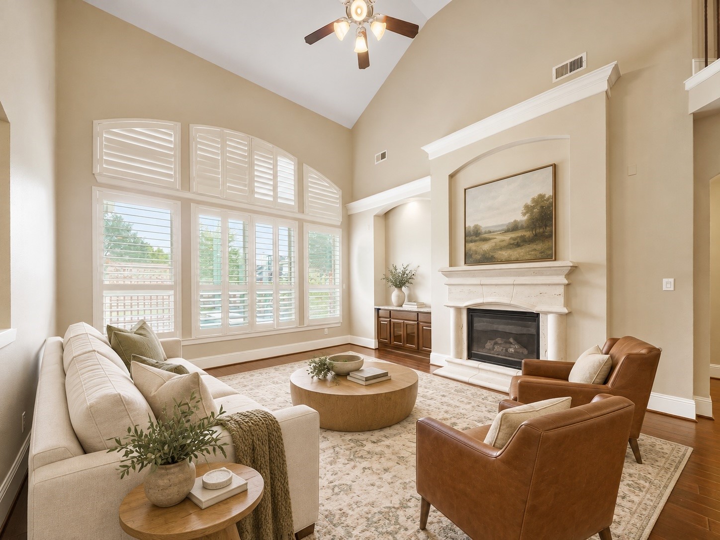 Virtually staged: Soft, collected furnishings reveal a relaxed gathering space centered around the fireplace.