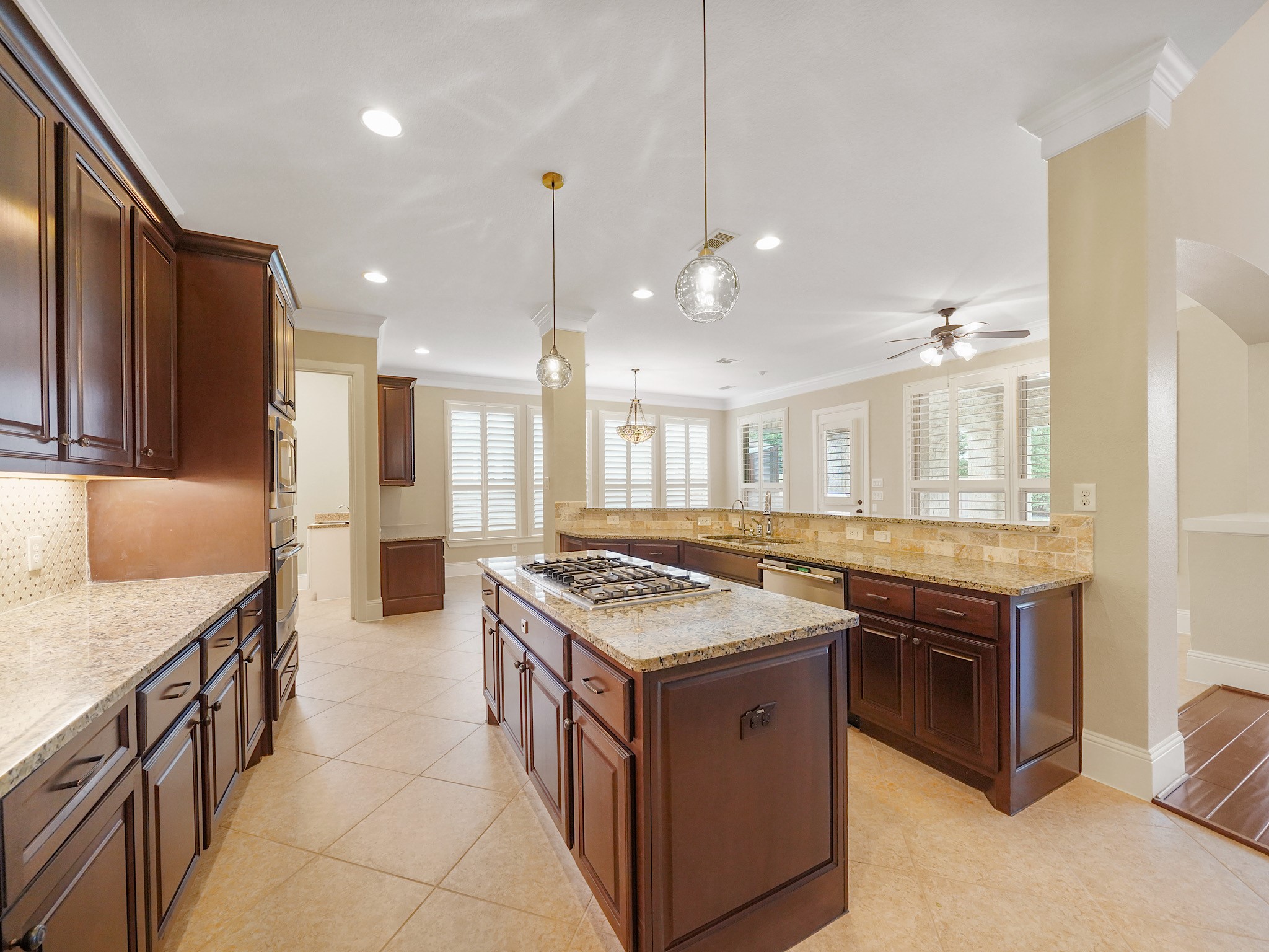 This additional kitchen angle captures the generous cabinetry and thoughtful layout that make cooking, serving, and gathering feel wonderfully effortless.