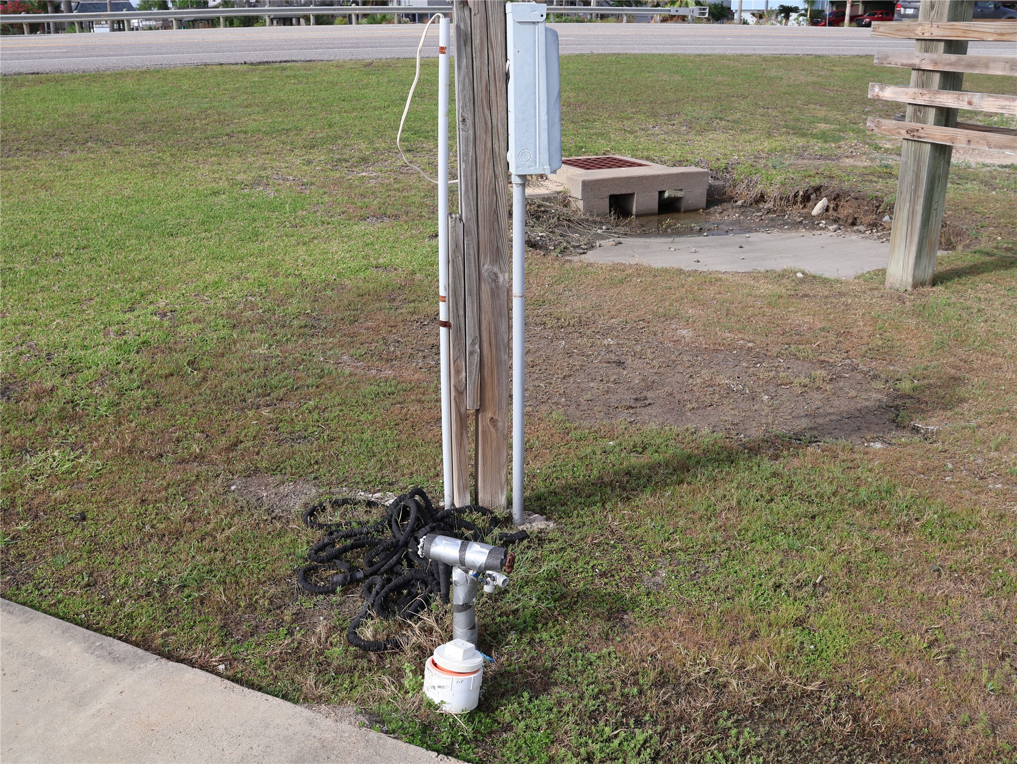 This photo shows an RC hookup near Highway 6. There's a small concrete section with a drainage grate. This photo shows an RC hookup near Highway 6. There's a small concrete section with a drainage grate.