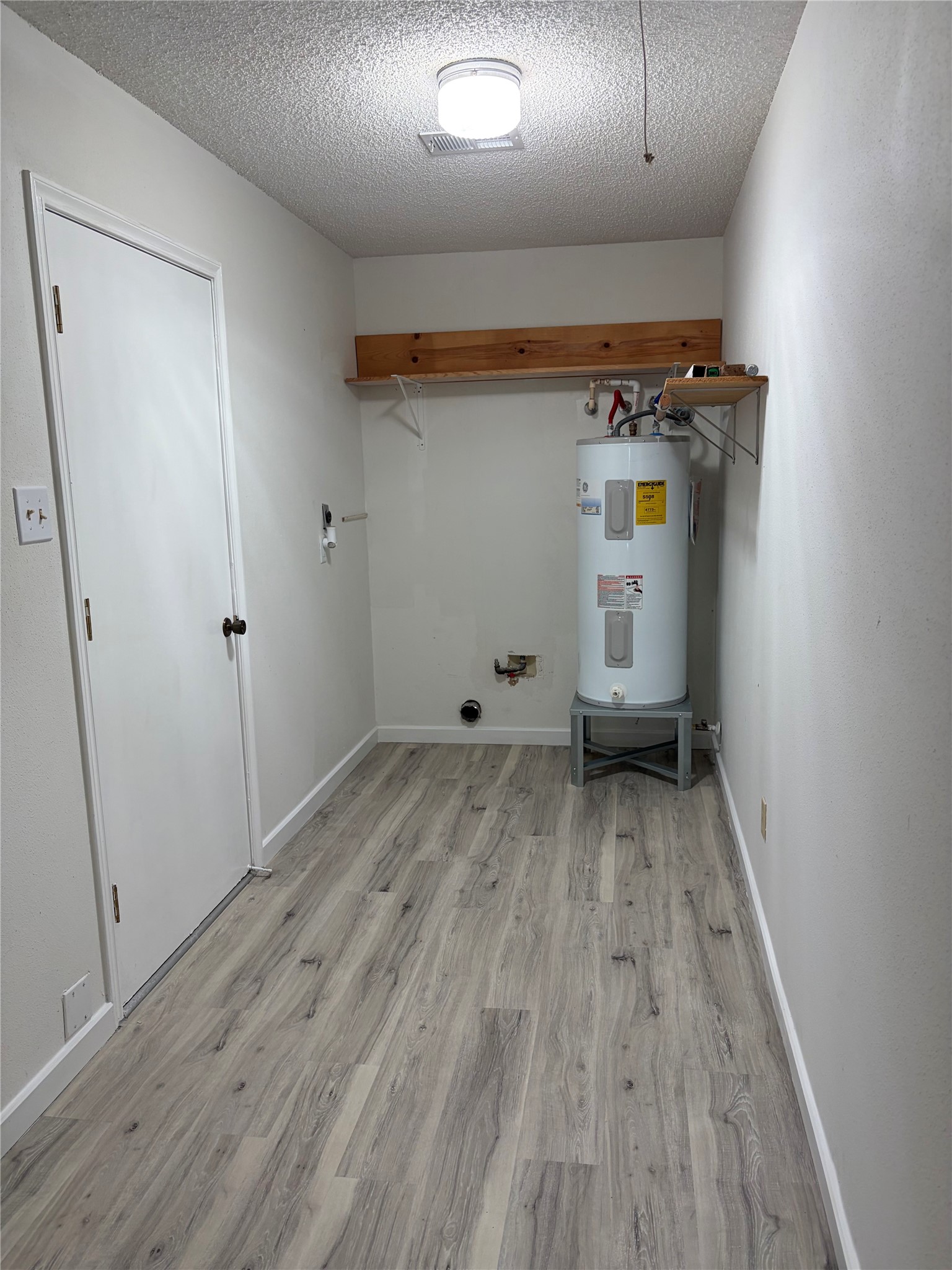 The utility room has lots of room and is inside the home. The washing machine hook ups are to the left as you walk in.  The dryer hook ups are straight ahead.