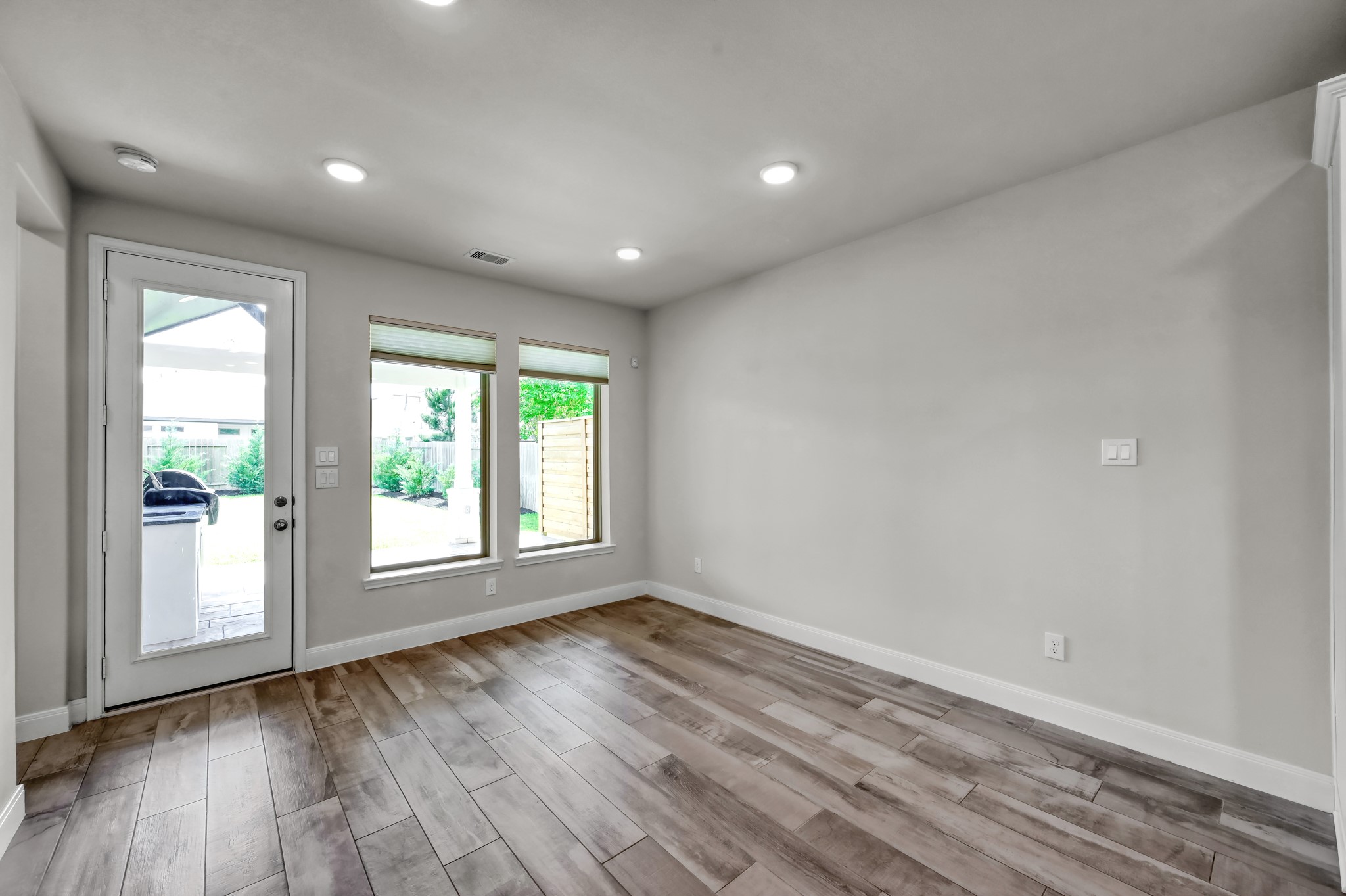 Bright dining area with backyard views and easy access to the covered patio.